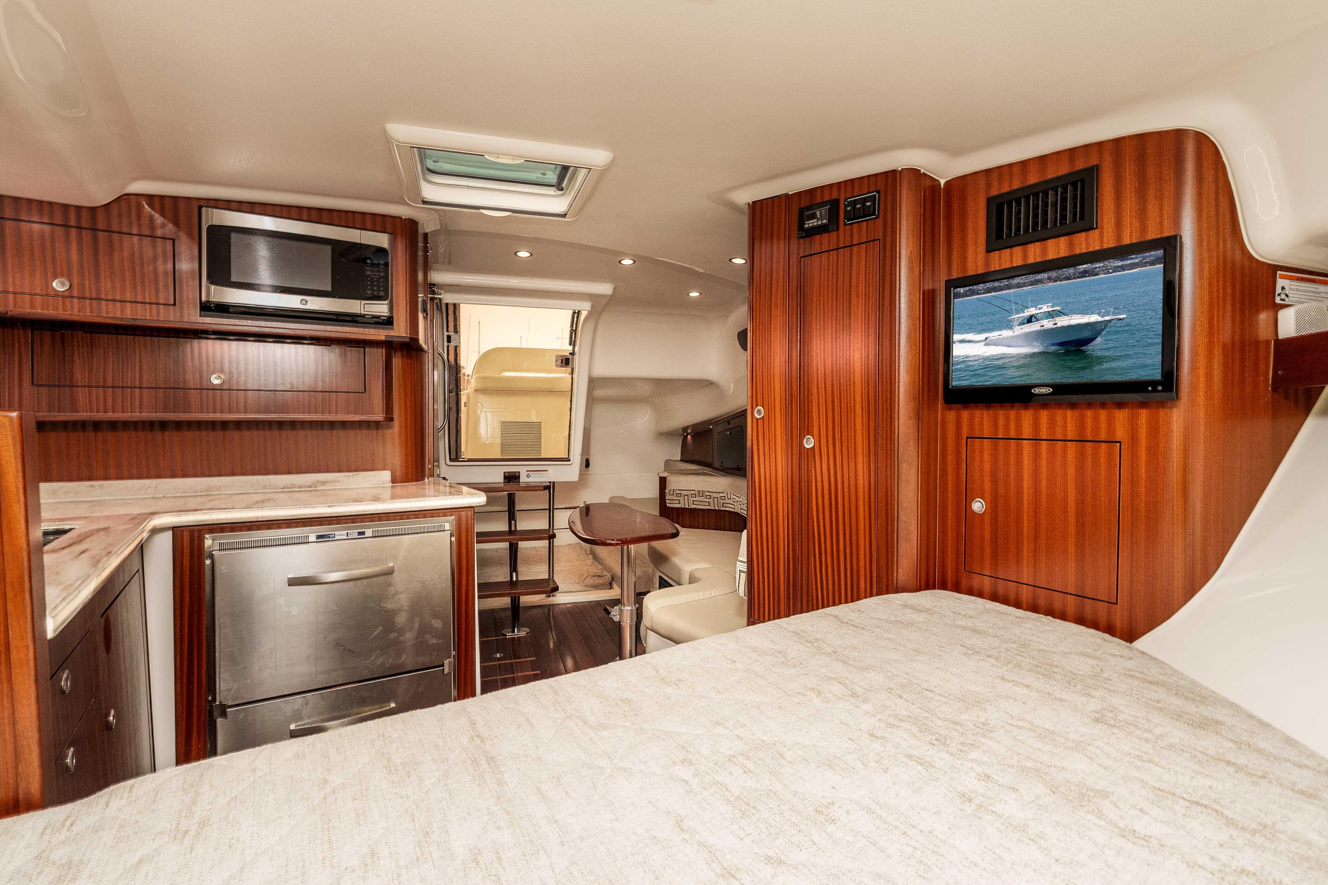 Luxurious interior of 2022 Pursuit OS 385 Offshore yacht with modern amenities.