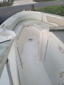 Interior view of a 1996 Wellcraft 2400S boat, white upholstery.