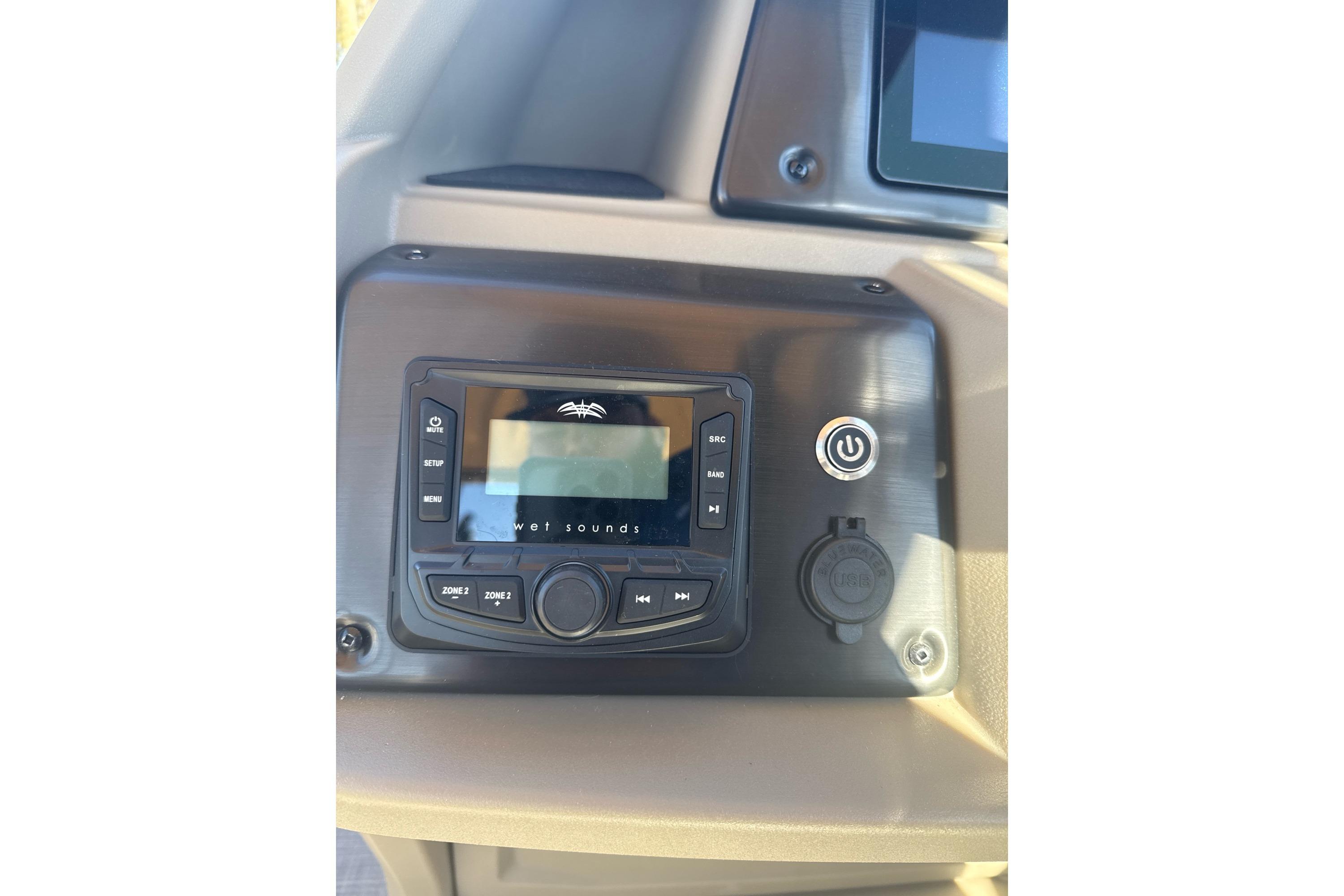 2025 Sun Tracker SportFish 22 DLX audio control panel with Wet Sounds system.