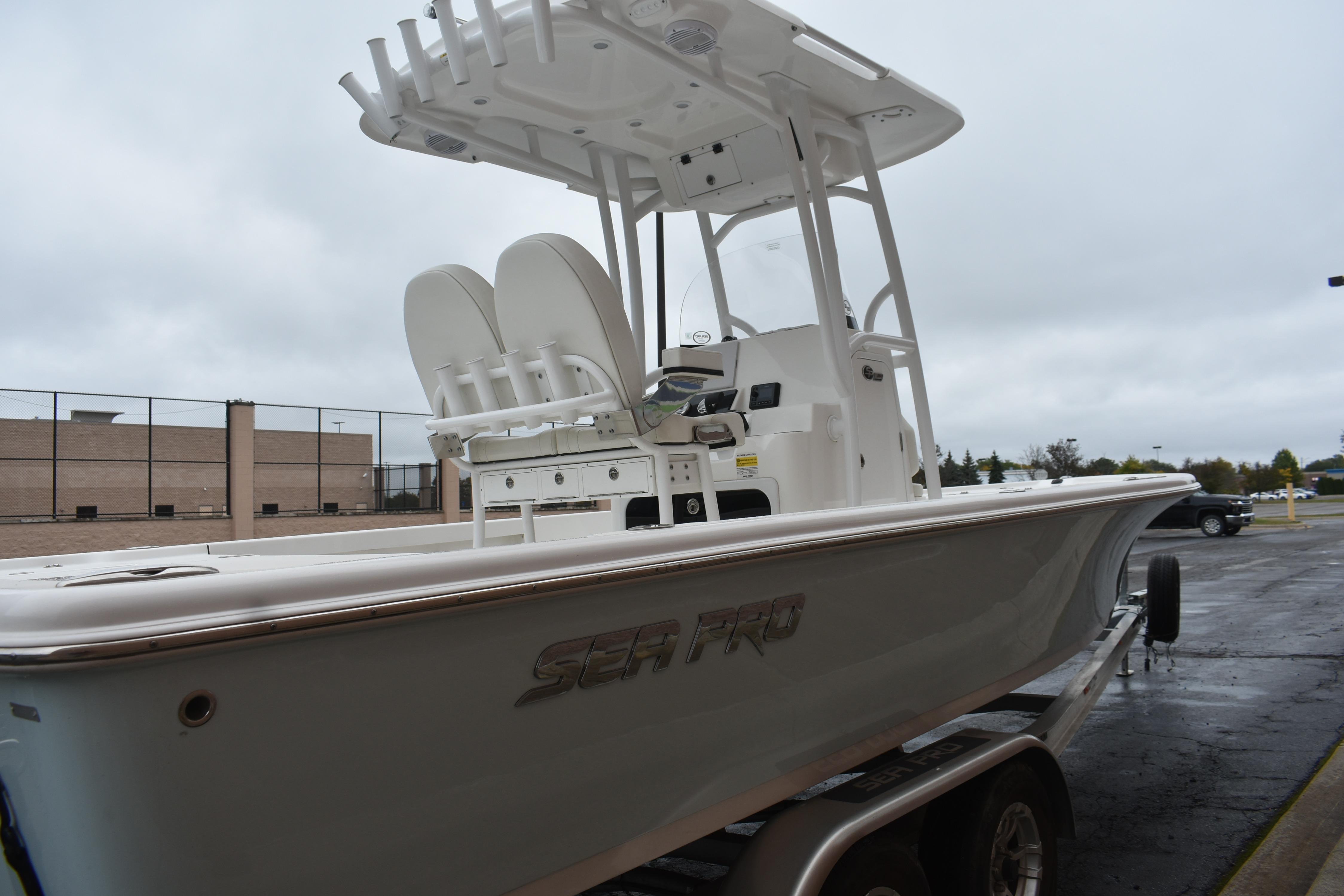 2025 Sea Pro 250 Bay boat on trailer, overcast day background.