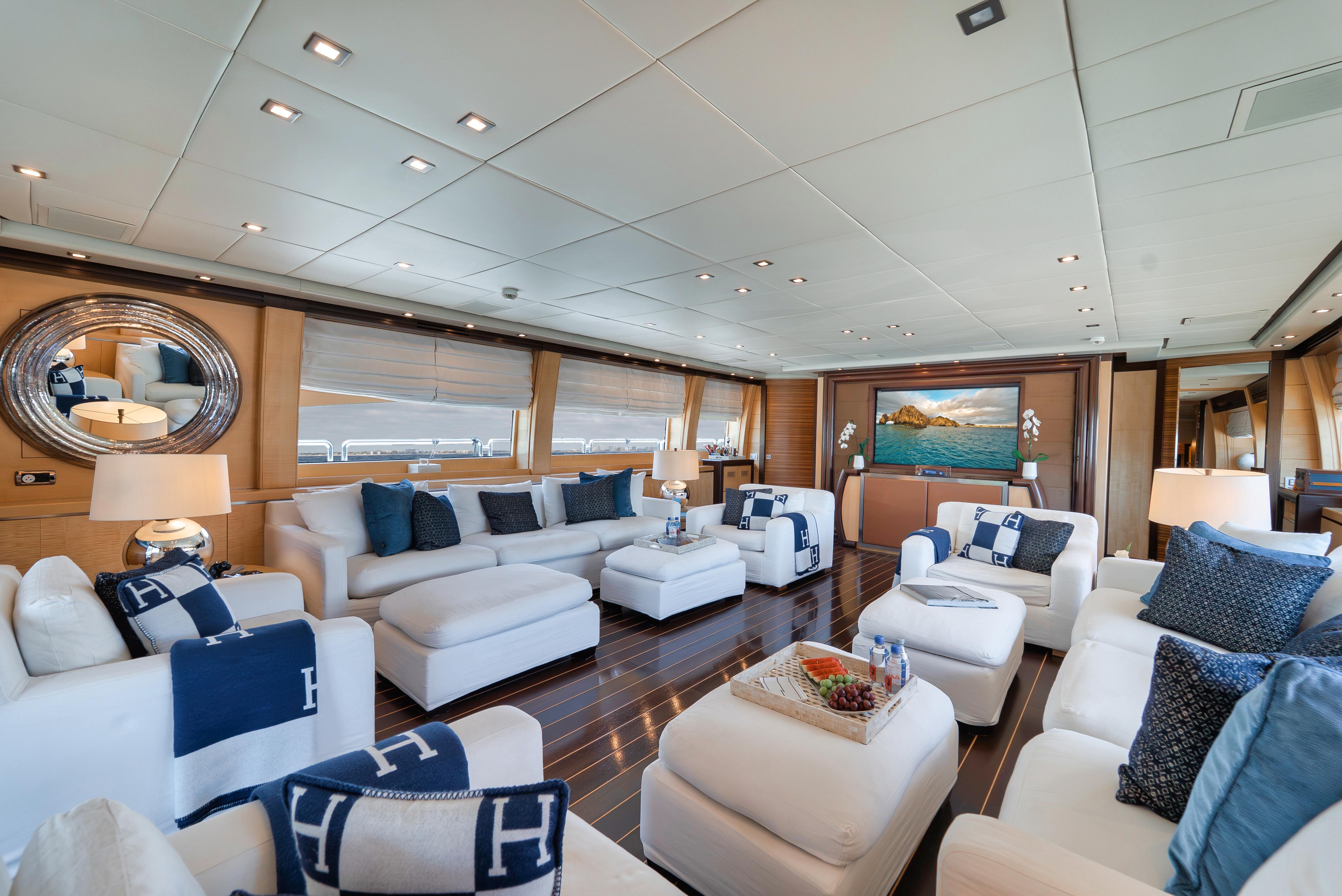 Luxurious interior of 2010 Arno Leopard 46 yacht with elegant white seating and nautical decor.