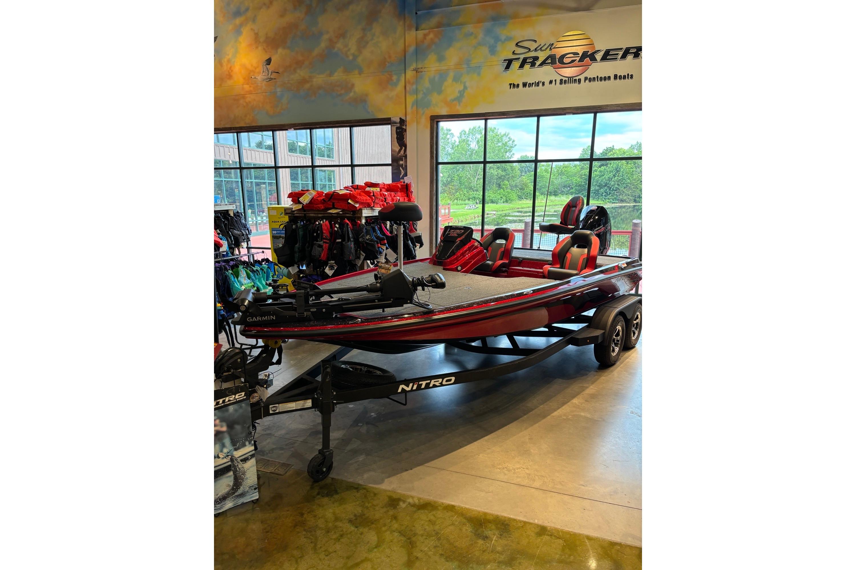 2026 Nitro Z20 XL Pro bass boat displayed indoors with fishing gear.