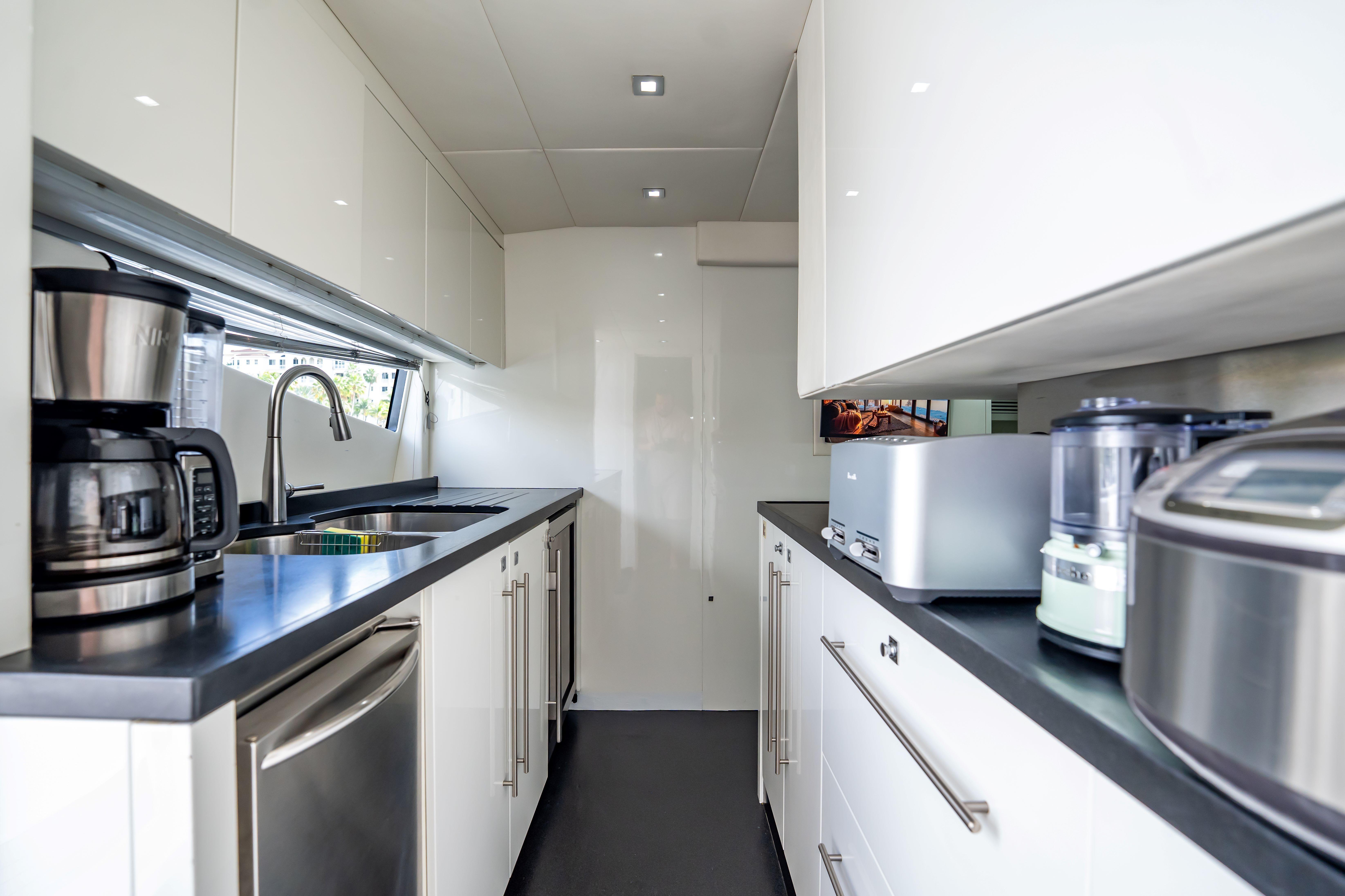 Modern kitchen interior on 2011 Sunseeker 34 Metre Yacht with sleek appliances and cabinetry.