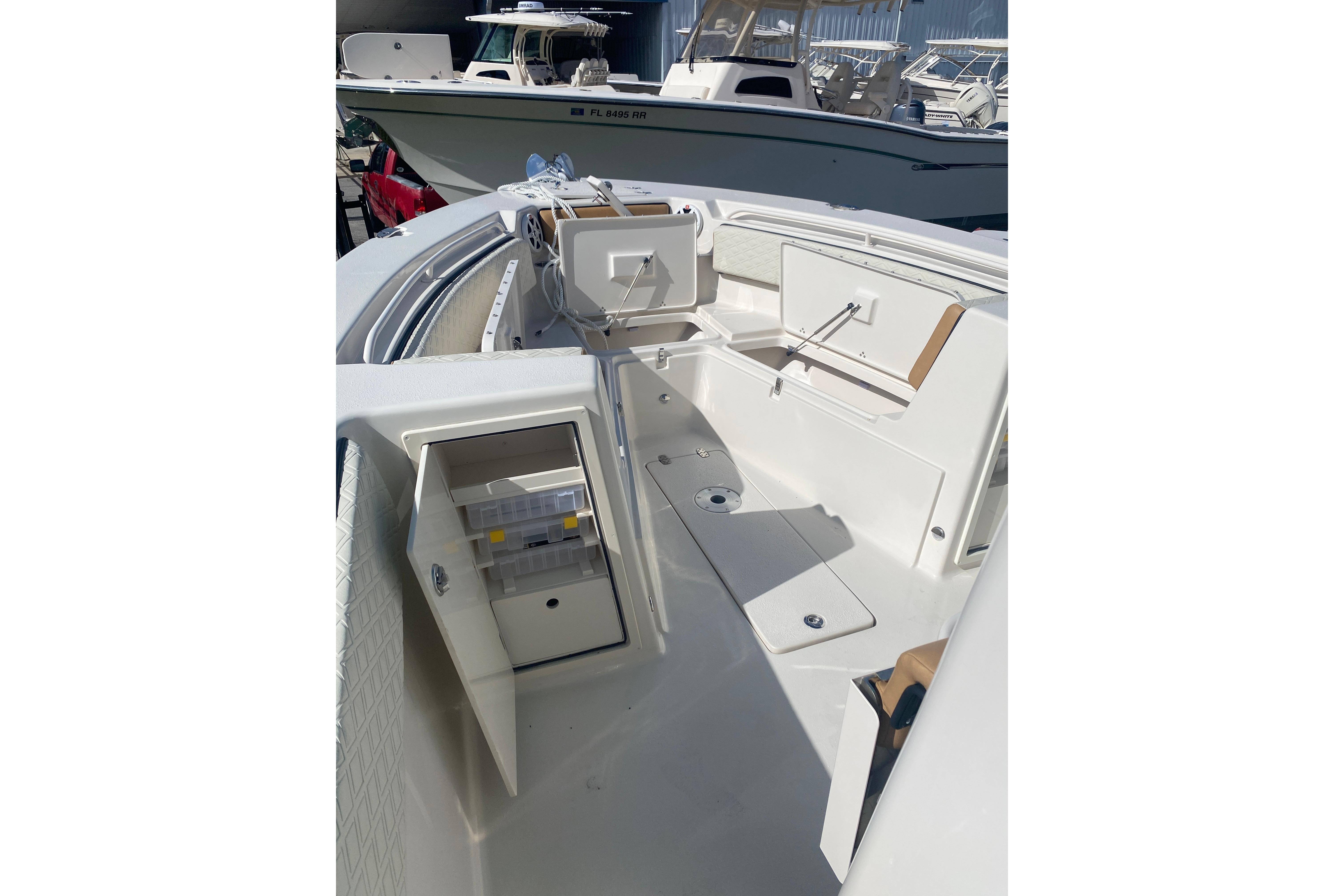 2026 Sea Chaser 30 HFC CC boat interior with storage compartments and seating.