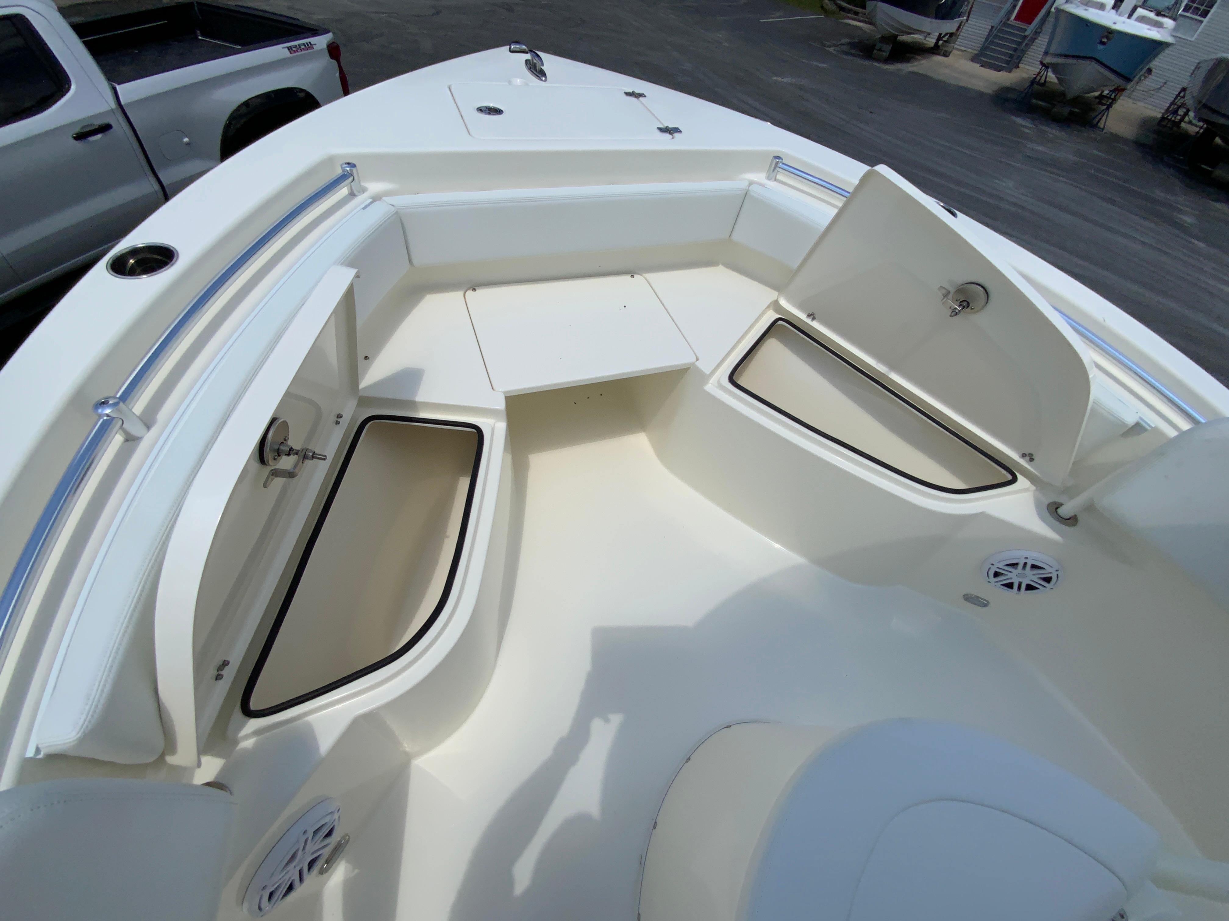 2025 Cobia 220 Center Console boat interior with open storage compartments.