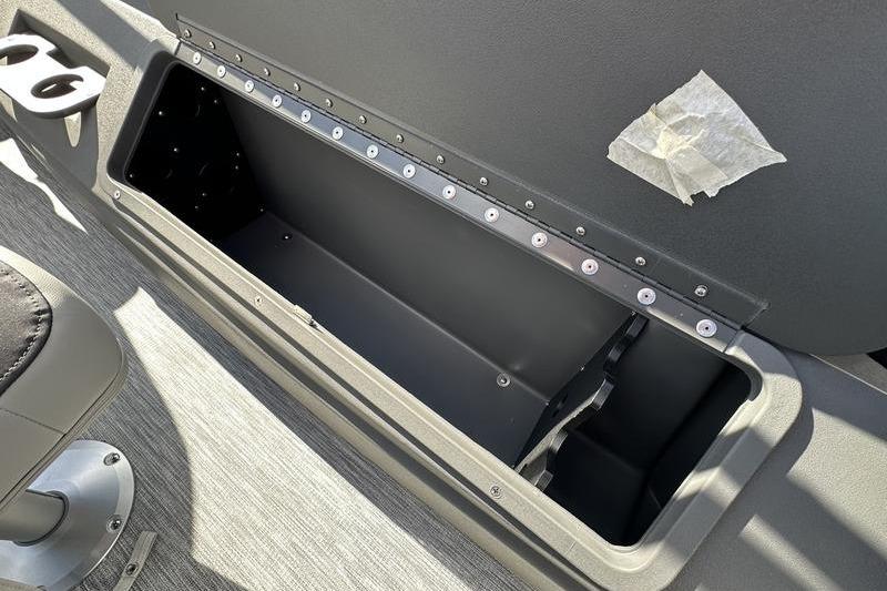 Open storage compartment in 2026 Bennington S 20 SF boat interior.