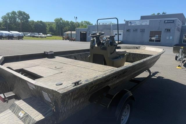 2026 Tracker Grizzly 1860 CC boat on trailer in outdoor dealership lot.