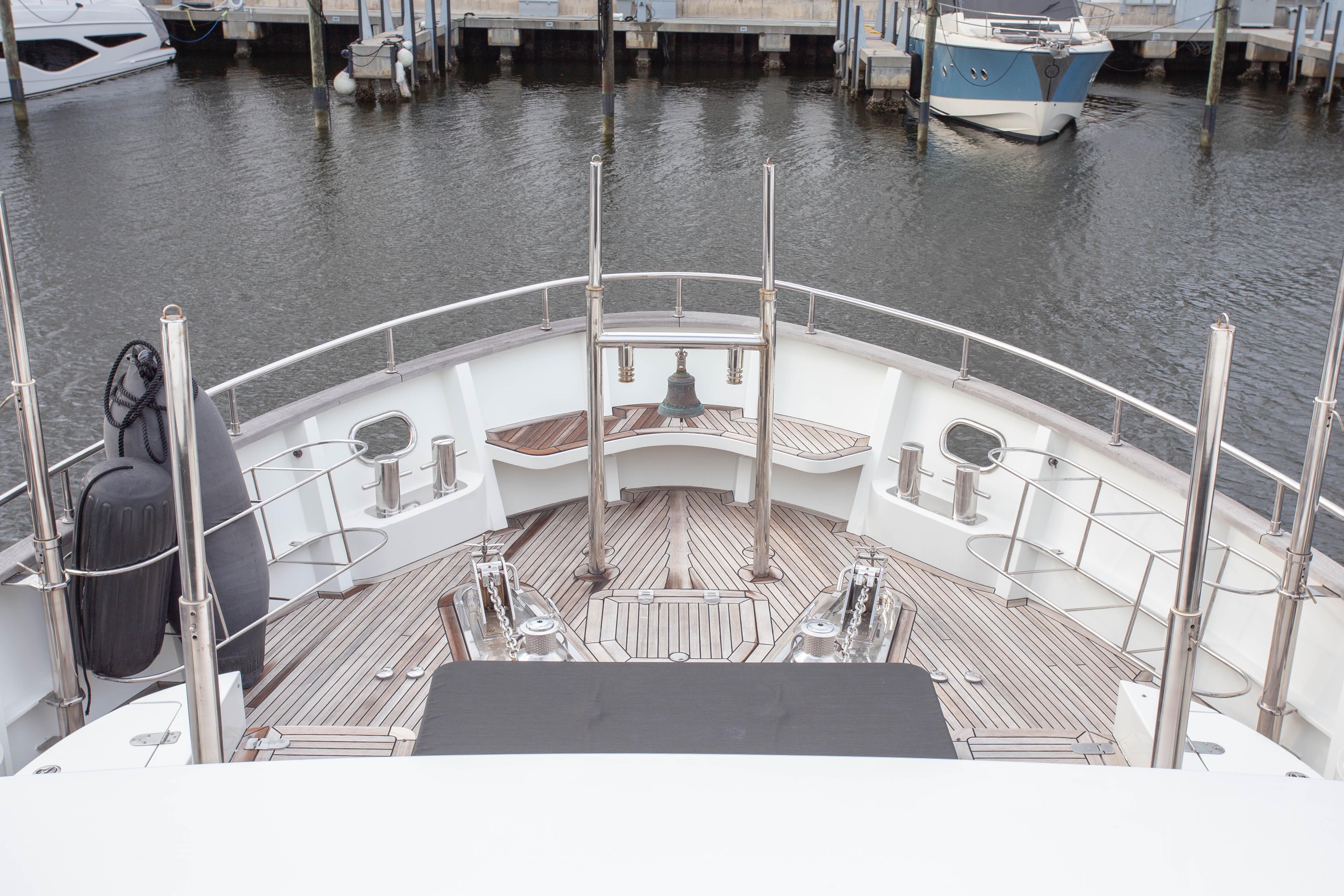 Deck view of 2014 Fifth Ocean Yachts 24m Displacement Explorer Yacht in marina.