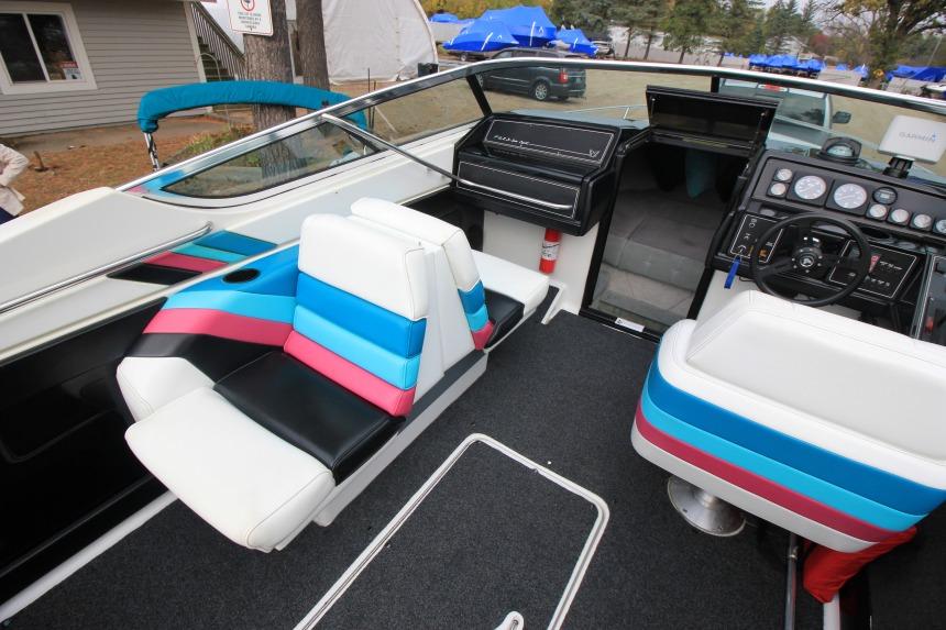 1989 Formula 223 SS boat interior with colorful seating and dashboard controls.