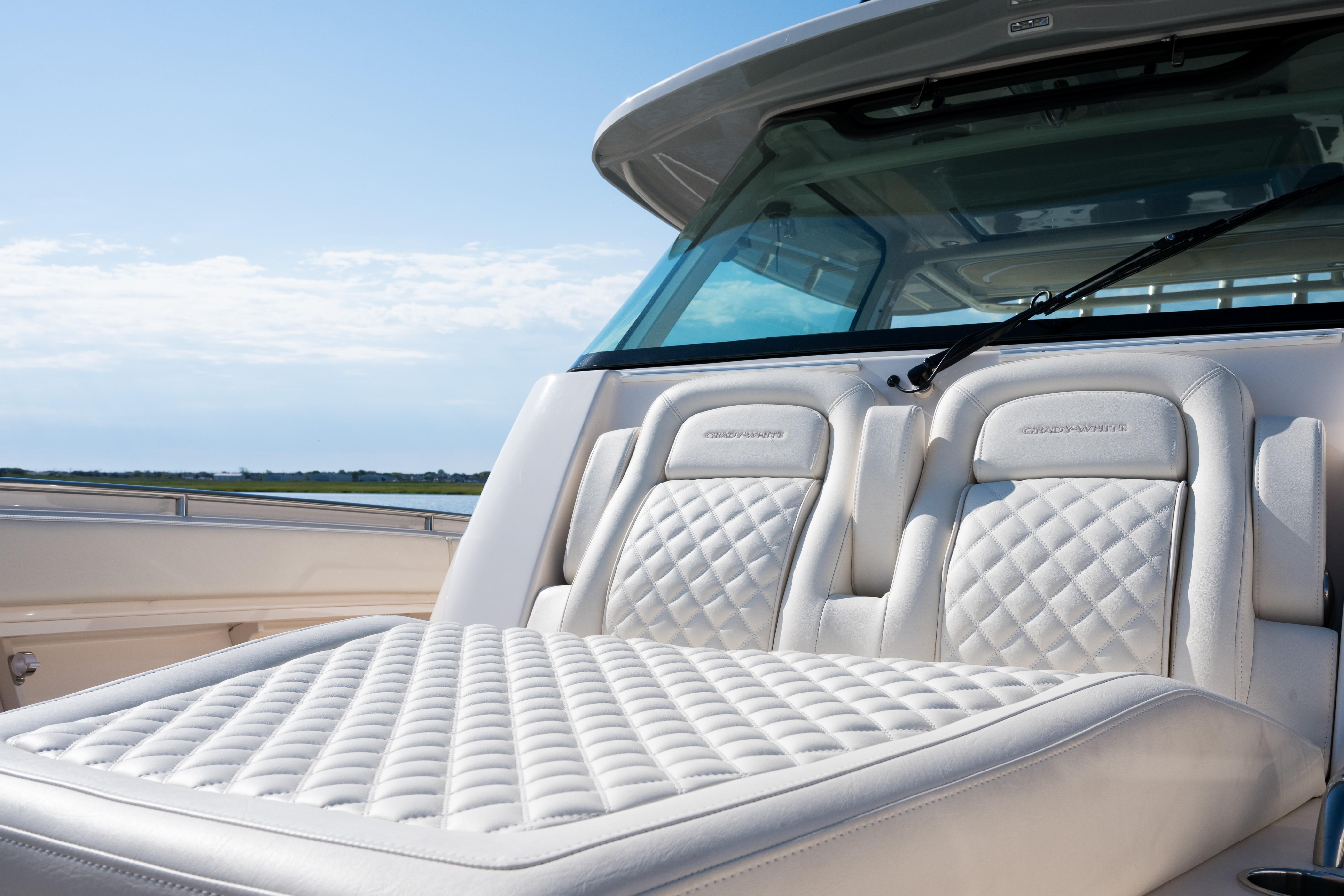 Luxurious seating on the 2025 Grady-White Canyon 386 boat, featuring elegant quilted upholstery.