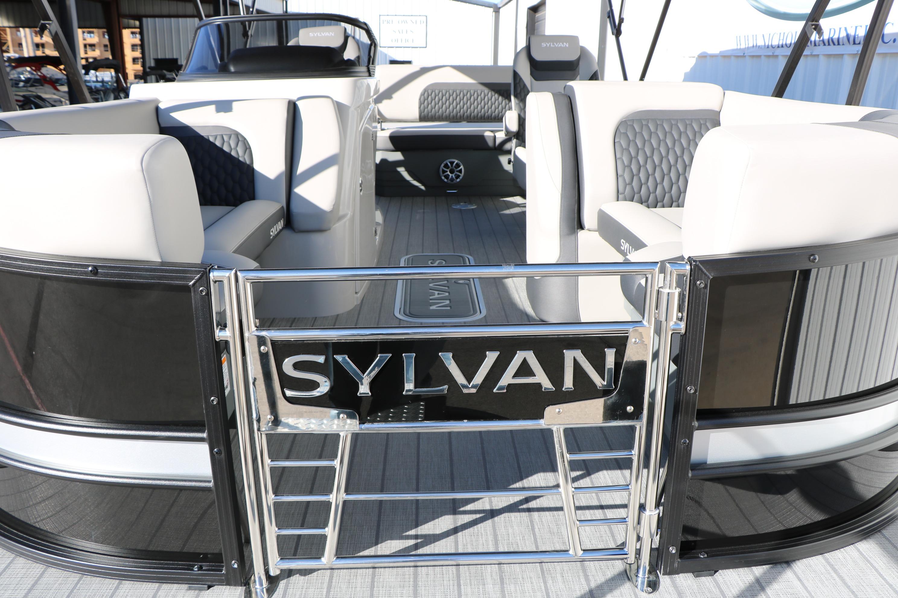 2026 Sylvan L3 CLZ DH pontoon boat interior with stylish seating and branding.