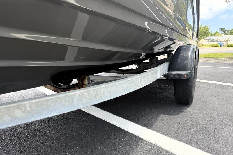 2017 Yamaha Boats SX210 on trailer in parking lot.
