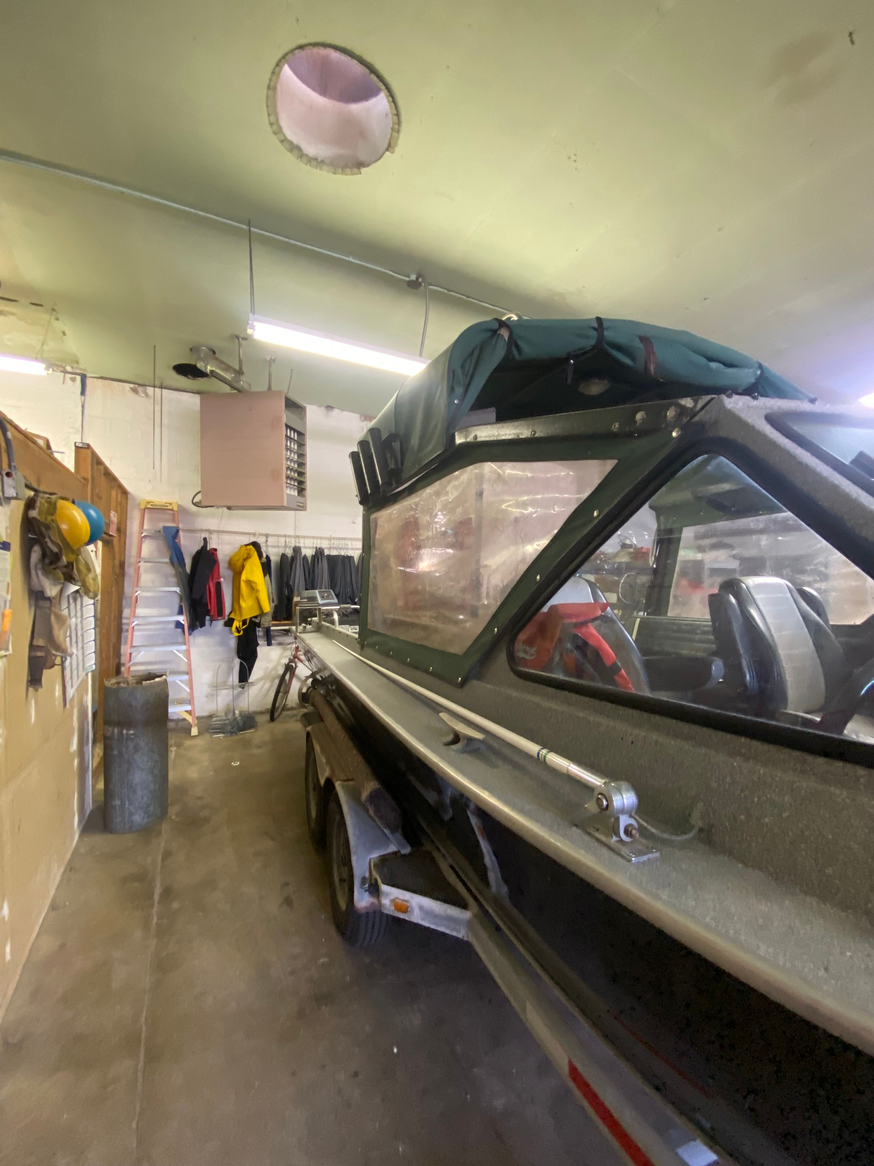 1993 Jetcraft Fastwater boat parked in a garage.