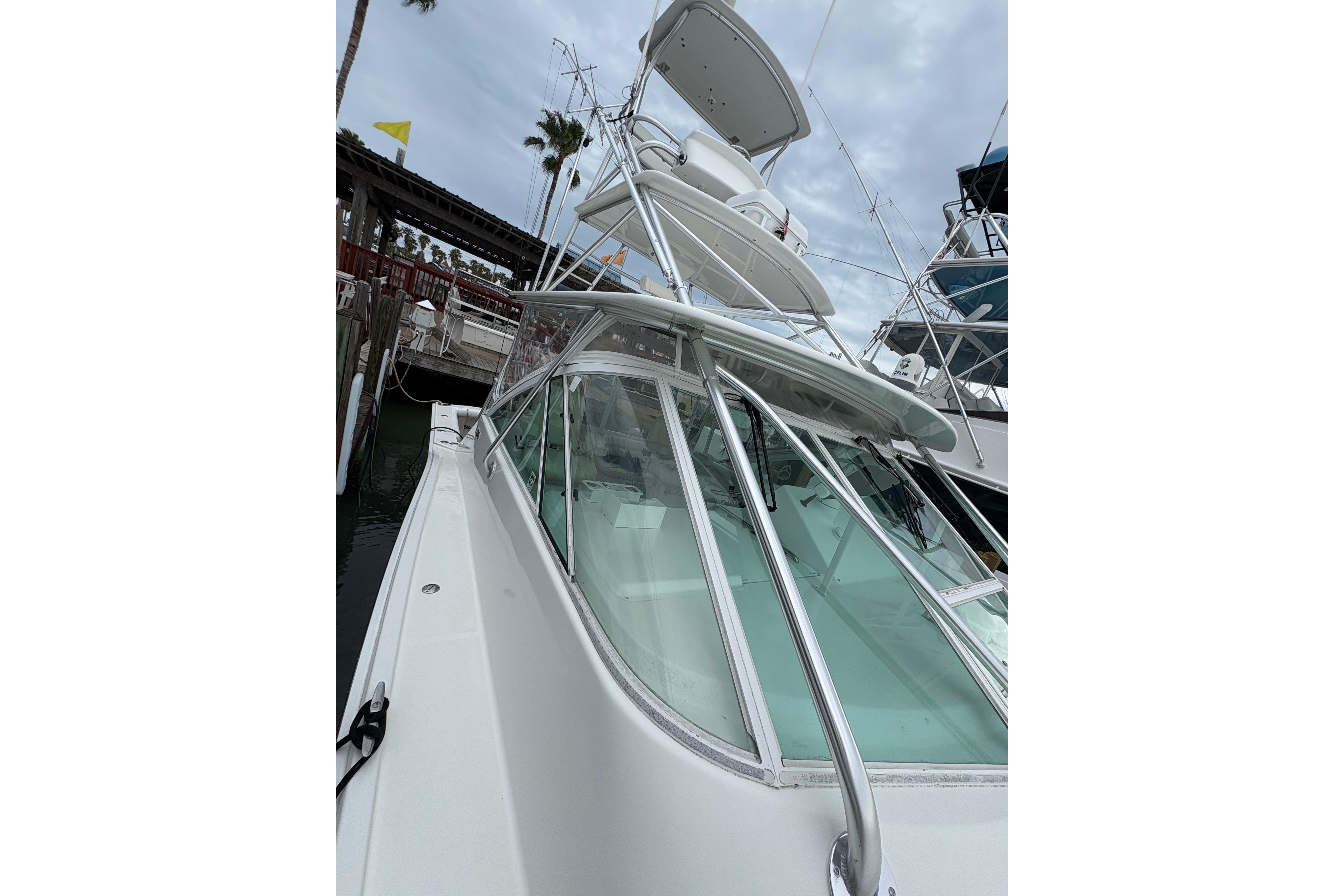 2004 Cabo 40 Hardtop Express yacht docked, showcasing sleek design and sturdy construction.