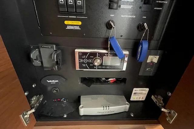 Control panel of a 2016 Sea Ray Sundancer 510 yacht with various switches and devices.