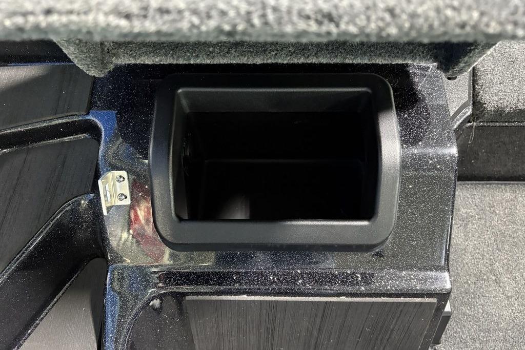 Storage compartment in 2026 Skeeter ZXE21 boat, featuring a sleek black interior design.