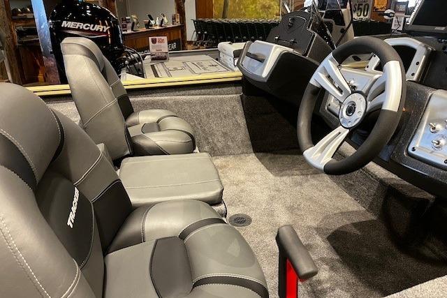 2026 Tracker Pro Team 175 boat interior with steering wheel and seating.