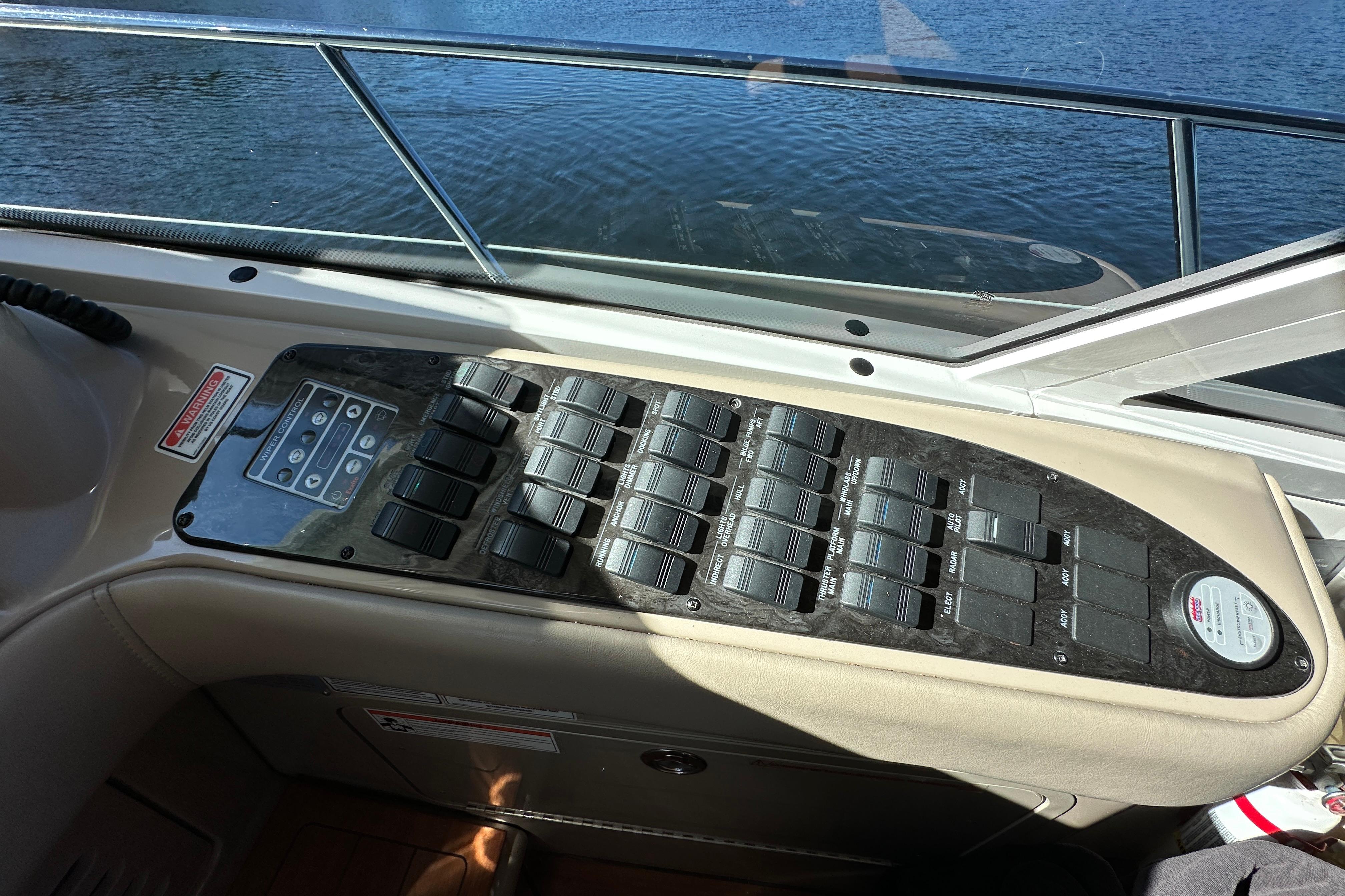 Control panel of a 2007 Sea Ray 60 Sundancer yacht, overlooking water.
