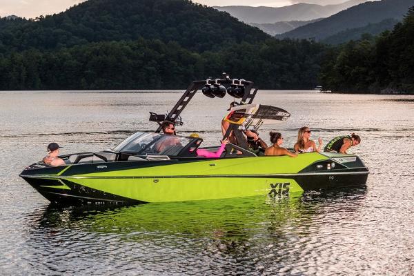 Manufacturer Provided Image: 2017 Axis T23 boat on a lake with people enjoying water activities.