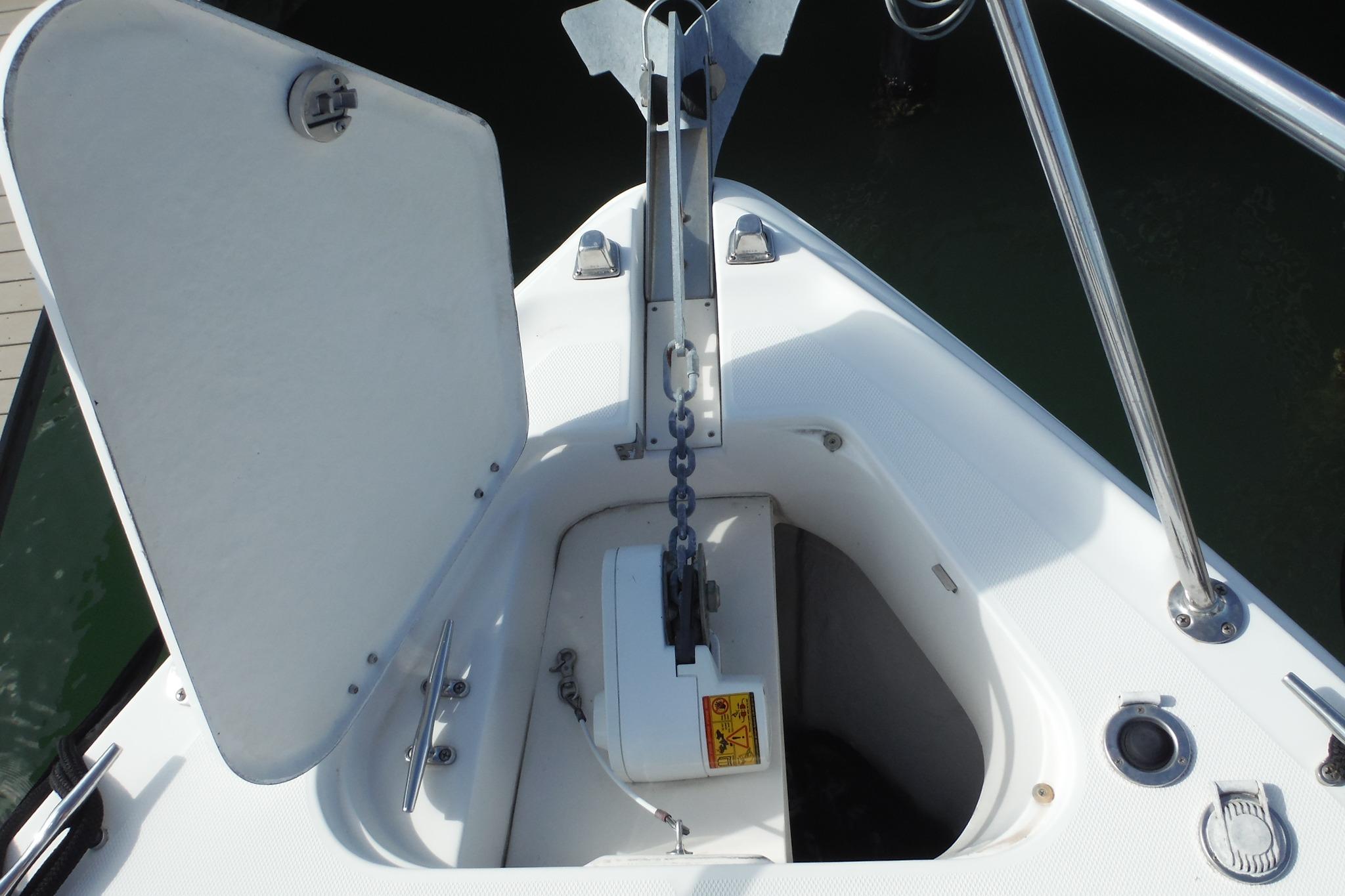 2005 Chaparral Signature 350 boat anchor compartment with open hatch and chain.