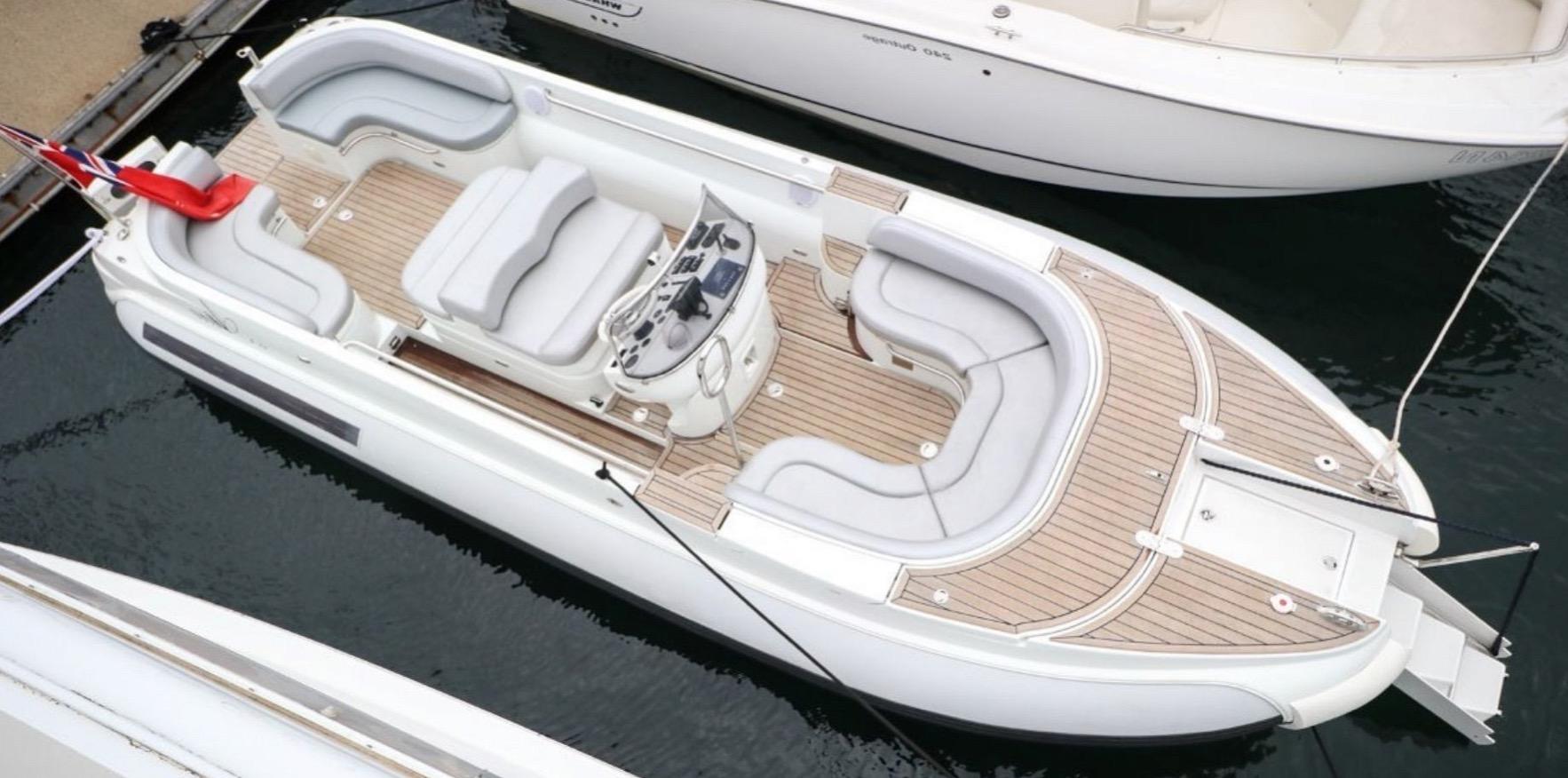 2008 Castoldi Jet Tender 23 boat docked in marina.