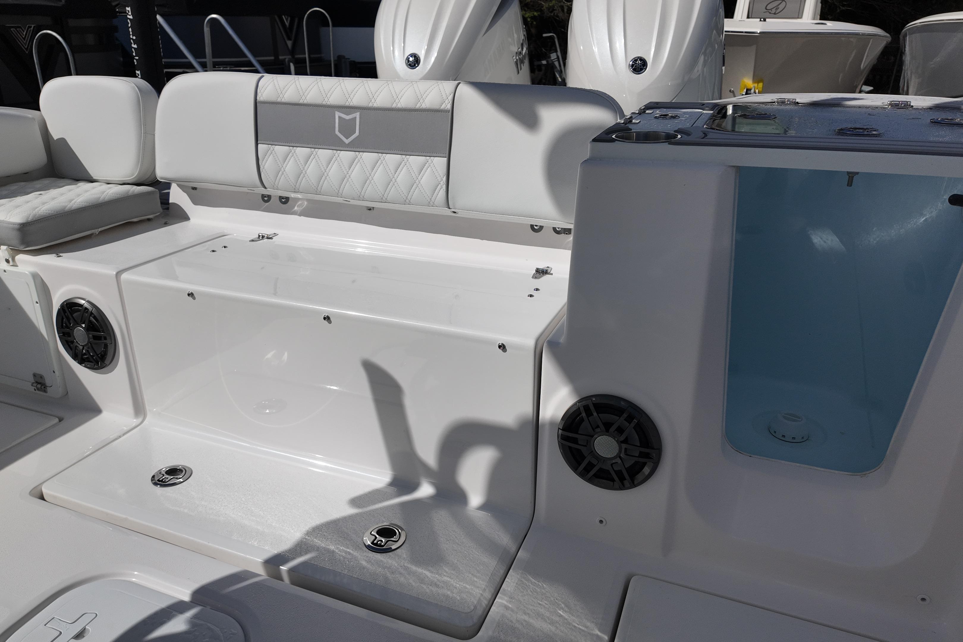 2026 Sea Fox 268 Commander boat interior with seating and storage compartments.