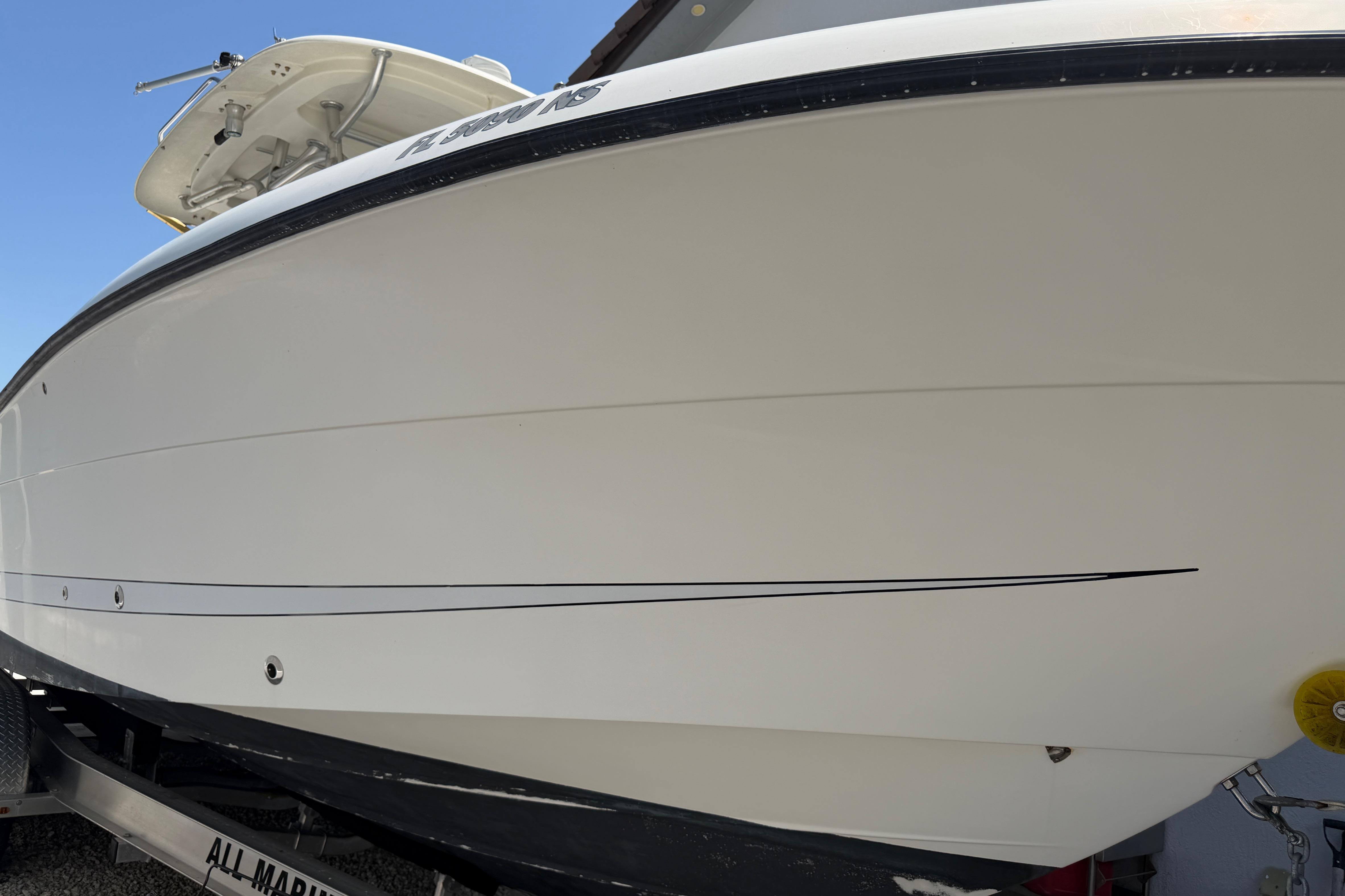 2008 Hydra-Sports Vector 2900 CC boat on trailer, side view, clear sky background.