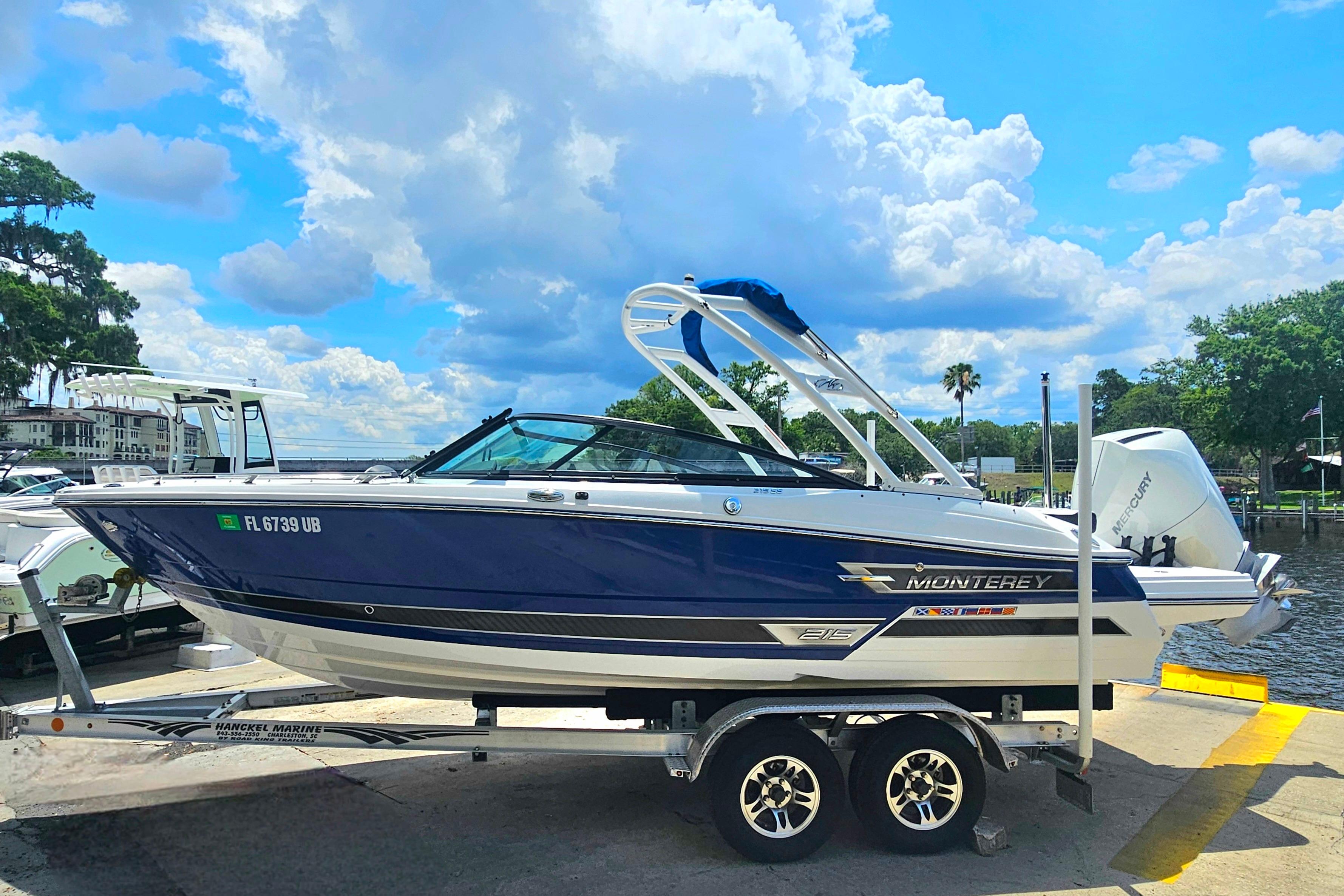 2024 Monterey 215SS Super Sport boat on trailer under a bright blue sky.