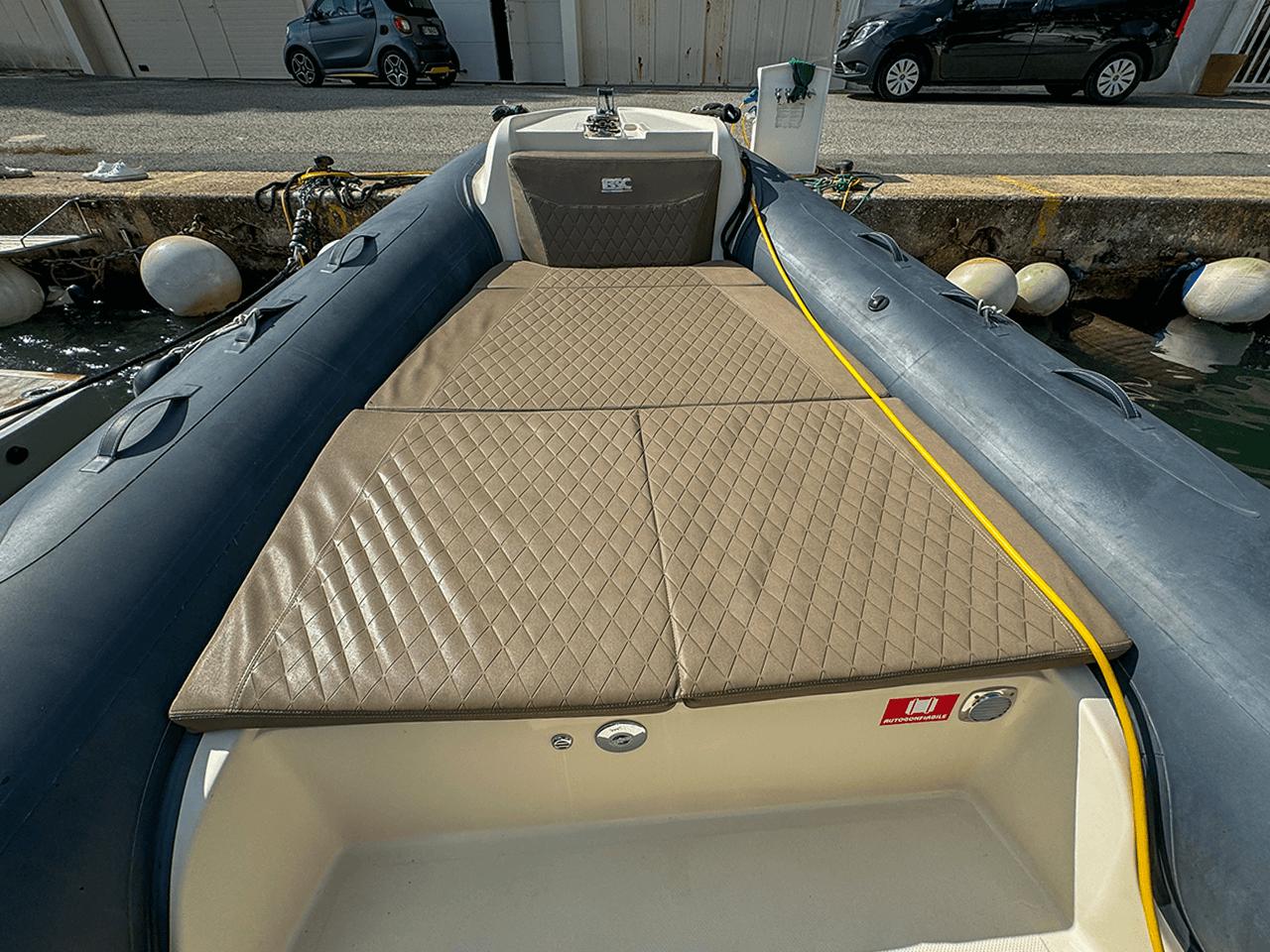 BSC 78 inflatable boat, 2019 model, with cushioned deck, docked at marina.