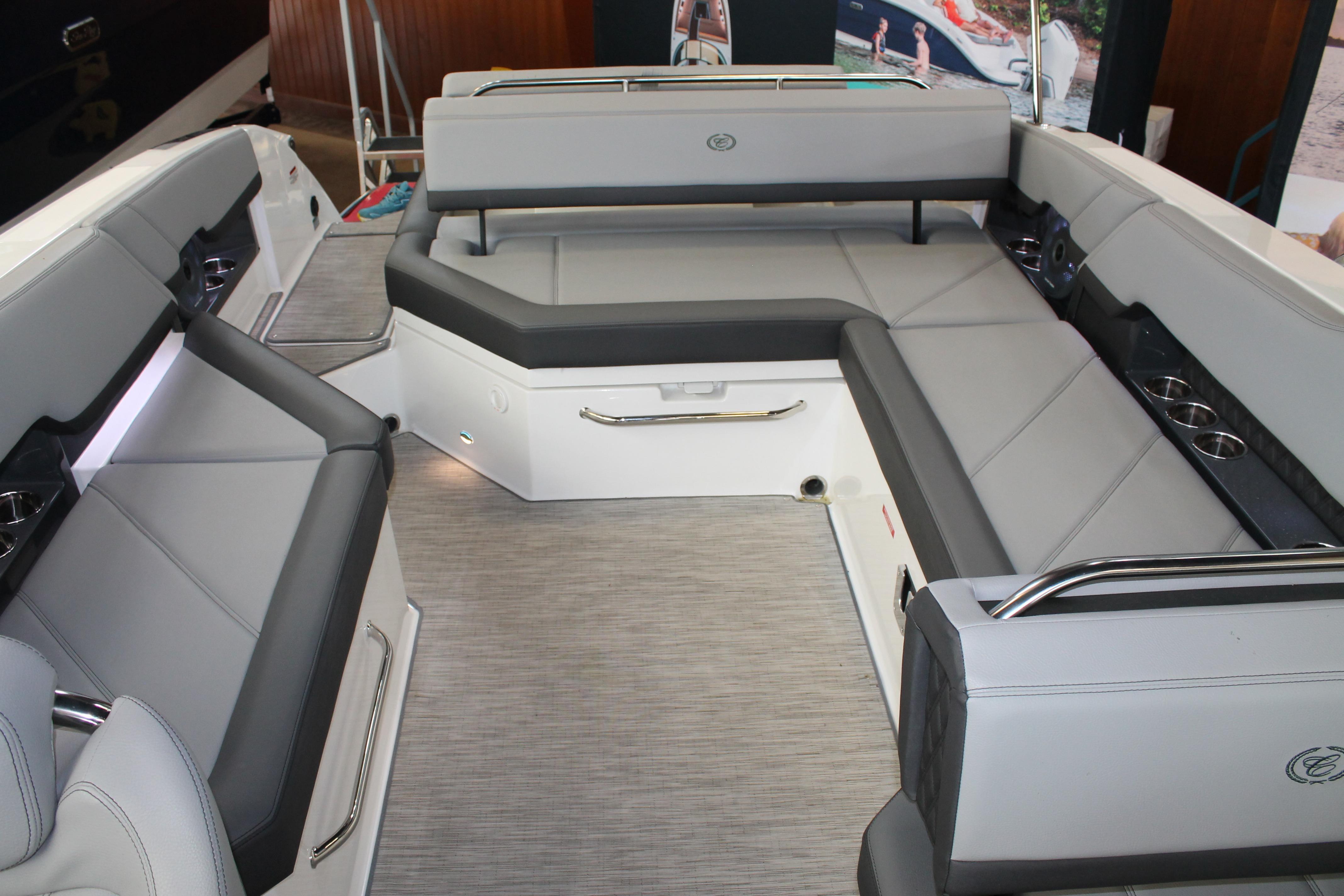 Luxurious seating area inside a 2023 Cobalt R8 boat, featuring sleek gray upholstery.