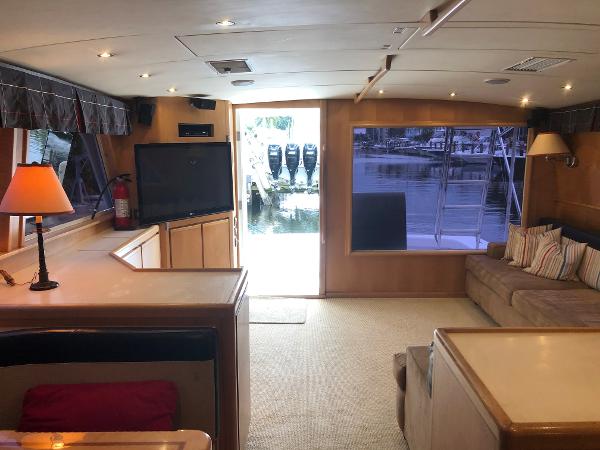 Interior of a 1997 Bertram Convertible yacht with modern amenities and waterfront view.