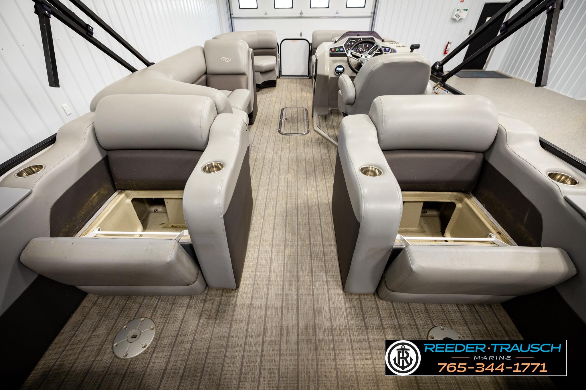 2019 Manitou Oasis SR VP pontoon boat interior with plush seating and storage compartments.