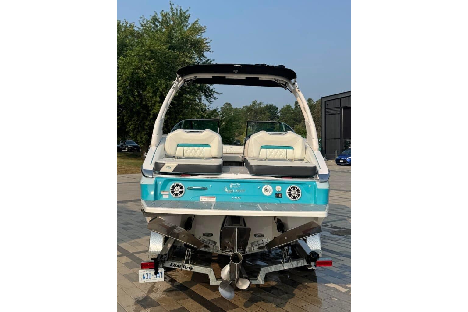 2022 Regal LS6 Surf boat, rear view, featuring sleek design and modern features.