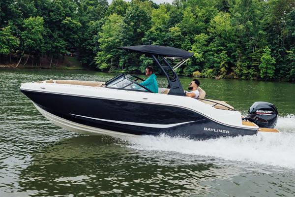 Manufacturer Provided Image: 2025 Bayliner D20 boat cruising on a lake with lush green trees in the background.