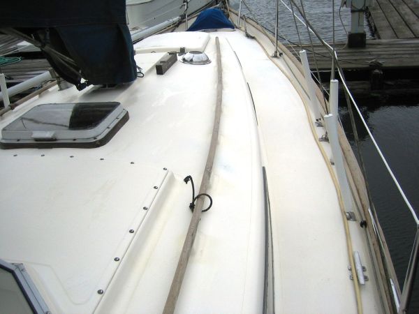 Deck of a 1974 Hallberg-Rassy Rasmus 35 sailboat in harbor.
