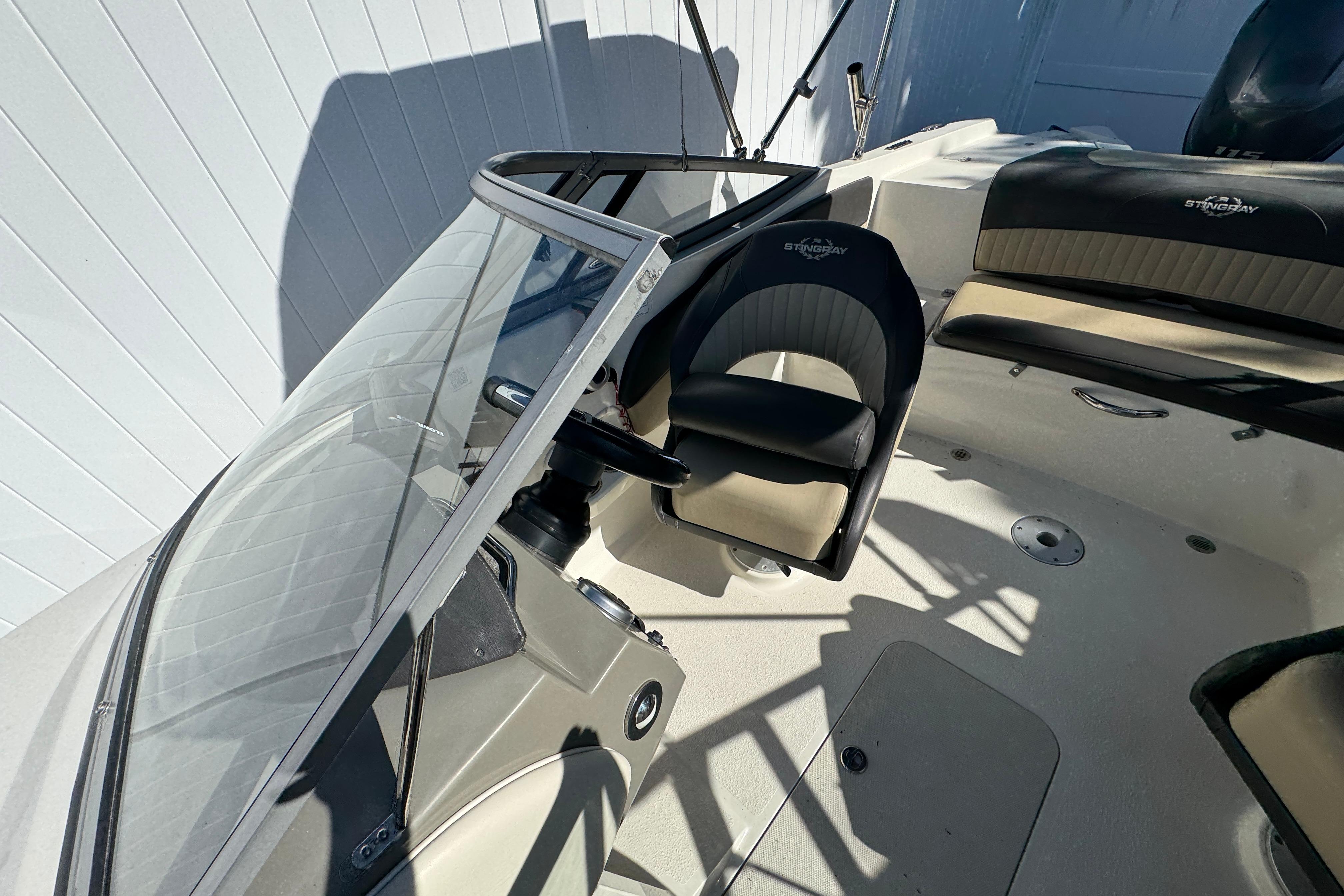 2018 Stingray 204 LR boat interior with steering wheel and seating.