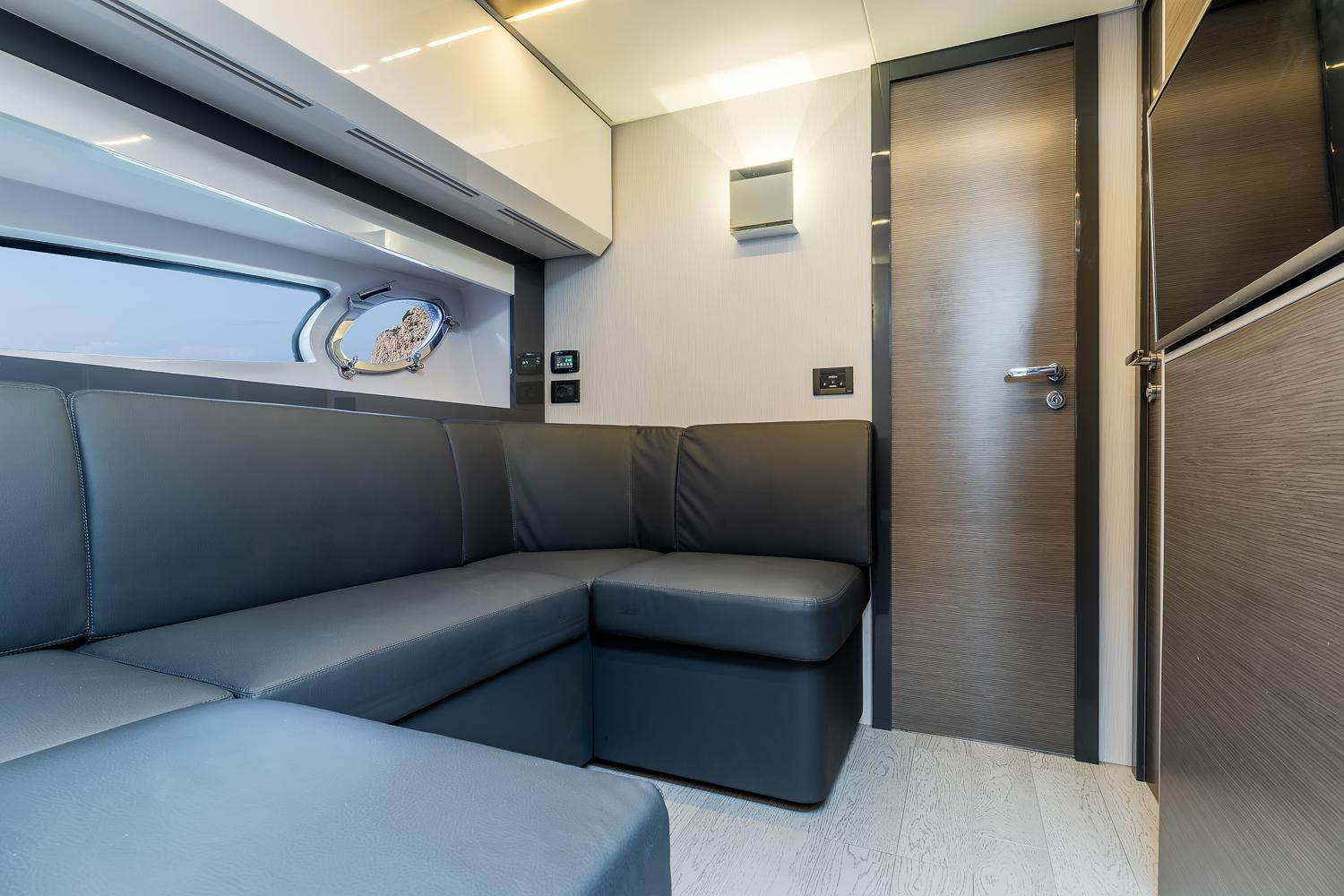 Luxurious interior of 2017 Pershing 5x yacht with sleek gray seating and modern design.