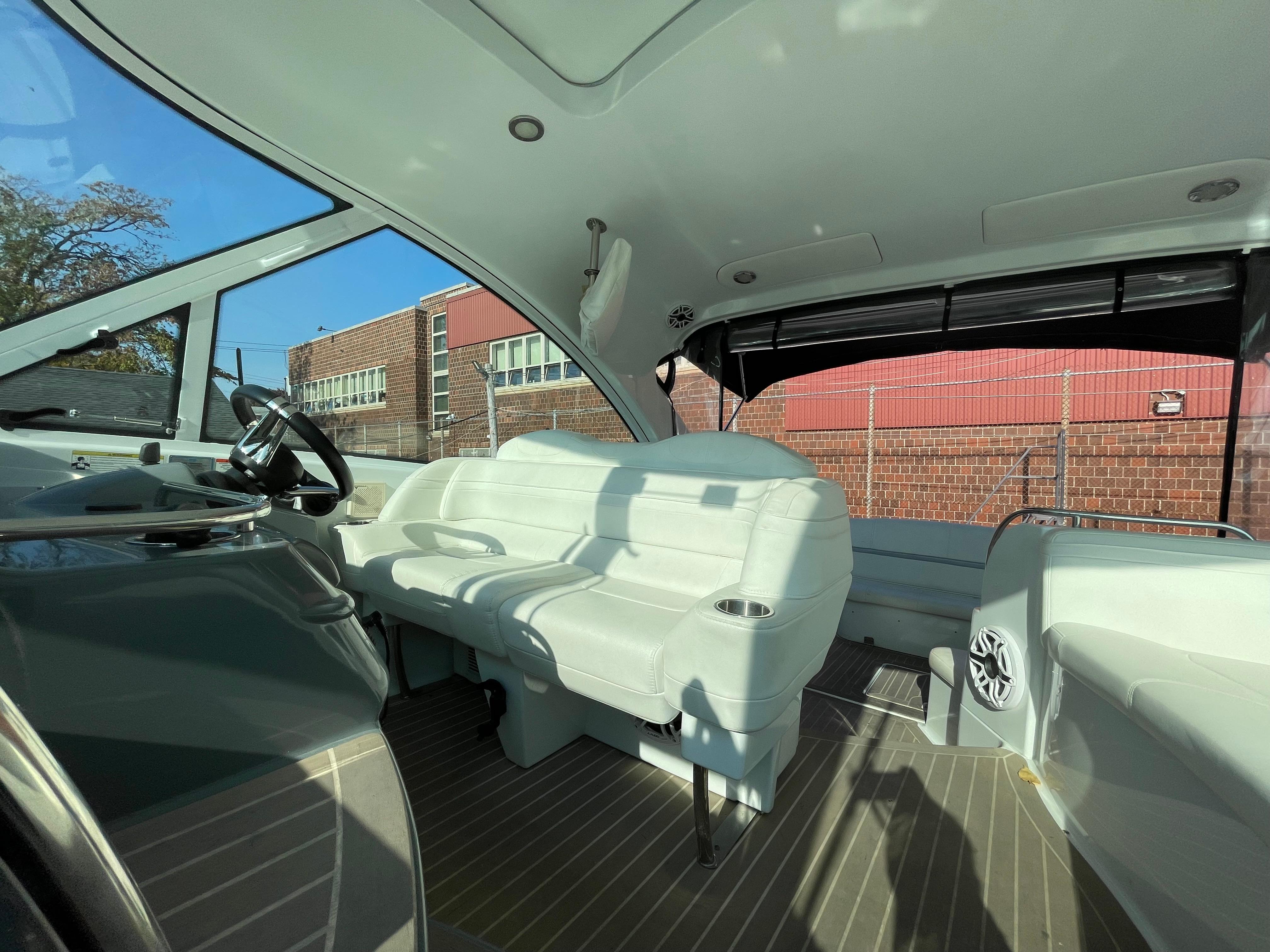Interior of 2014 Formula 45 Yacht with white seating and modern design.