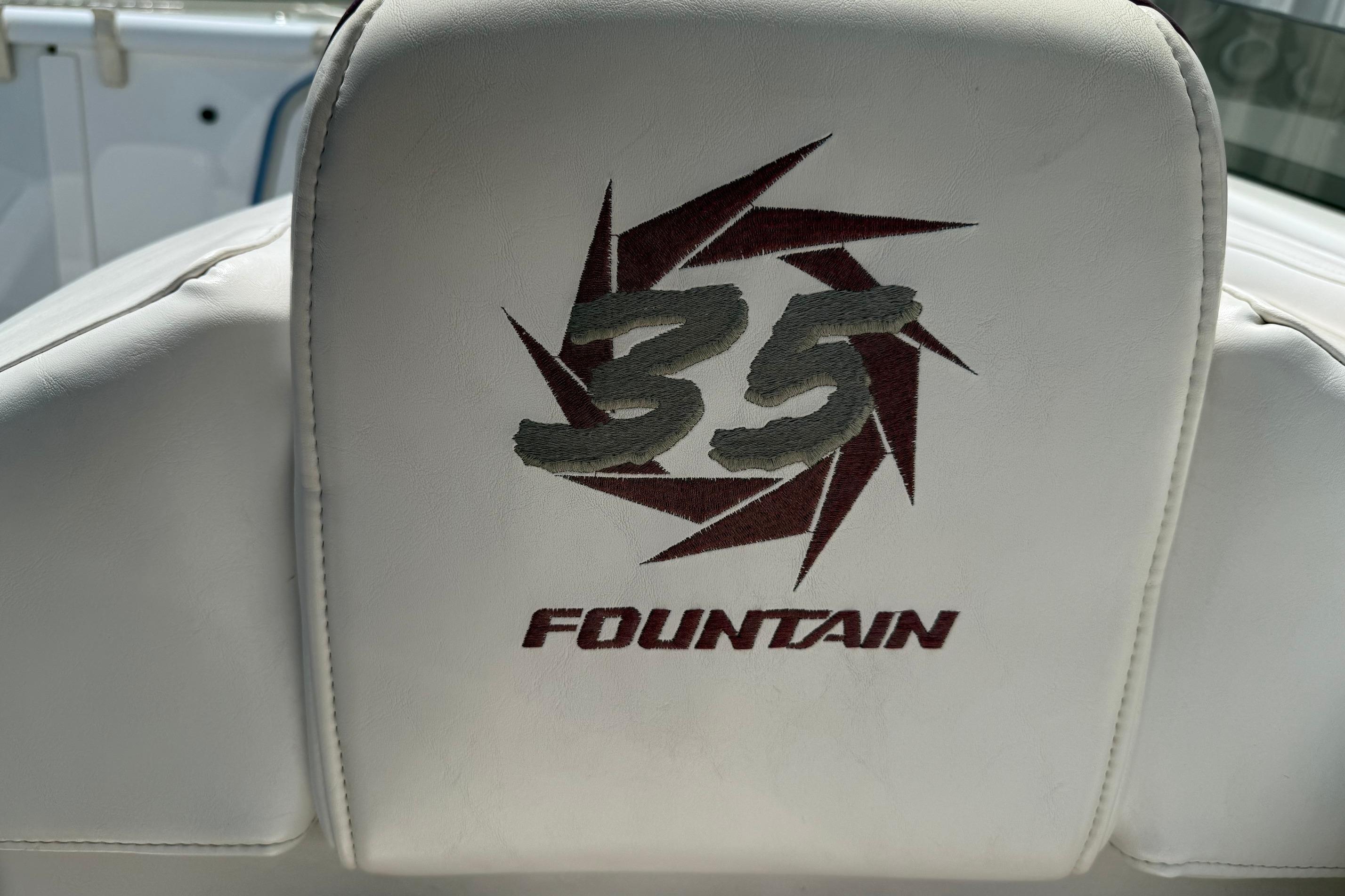 Embroidered logo on white seat of 1998 Fountain 35 Lightning boat.