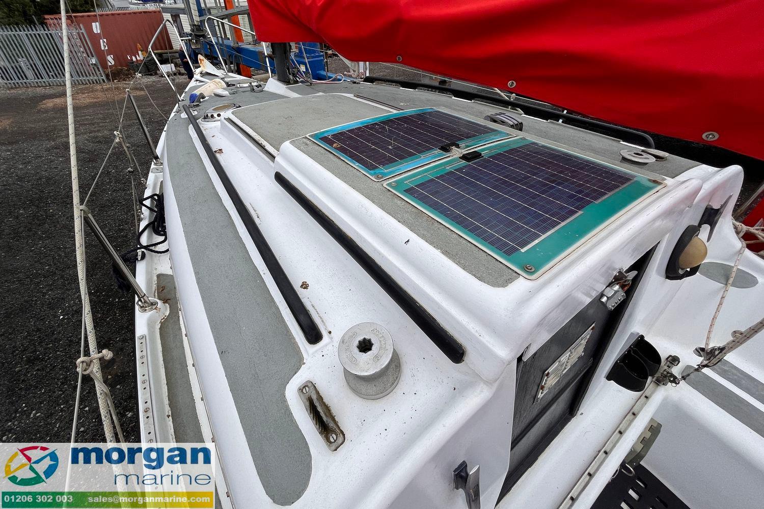 1979 Leisure 23 sailboat with solar panels on deck, displayed at Morgan Marine.