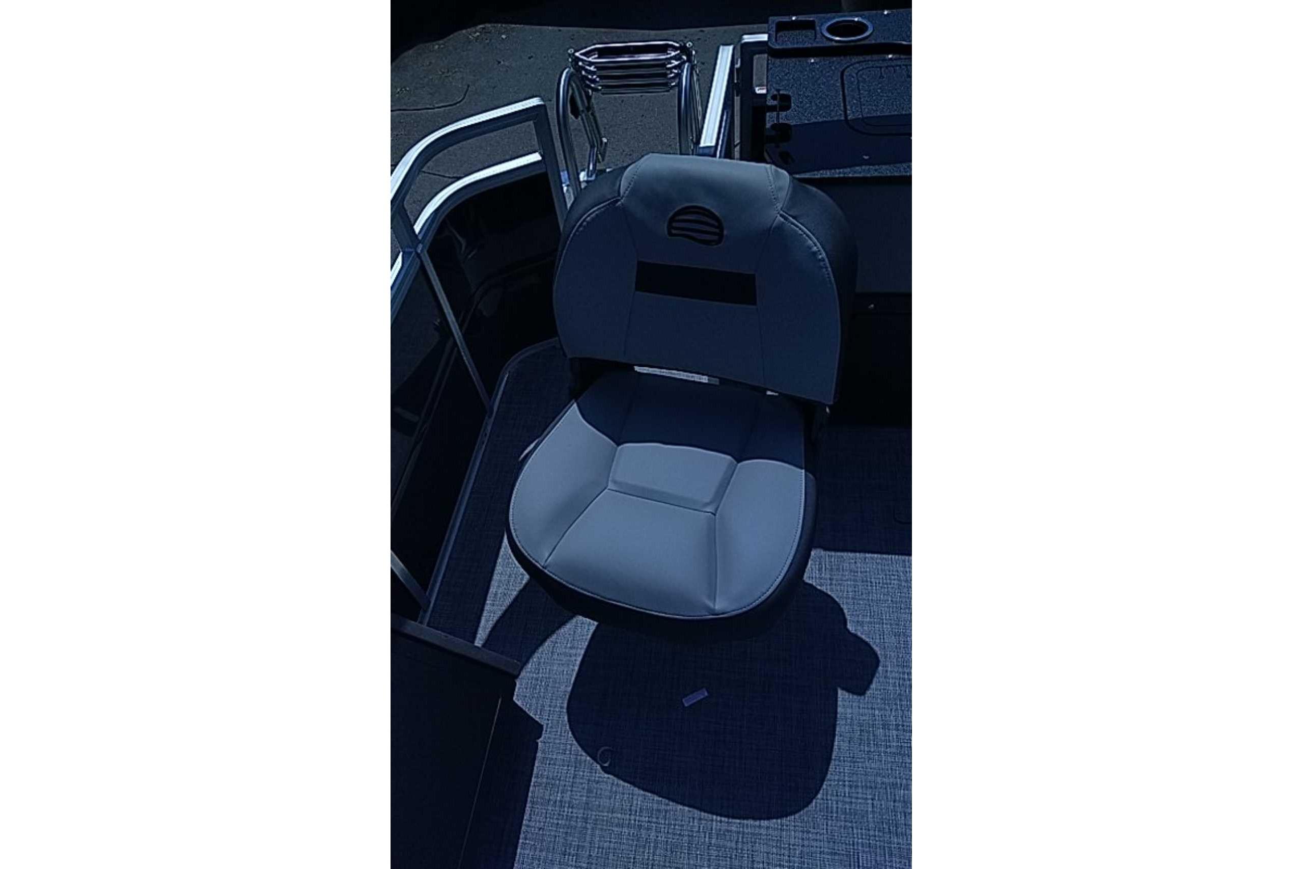 Captain's chair on 2026 Sun Tracker SportFish 22 DLX pontoon boat, featuring sleek design.