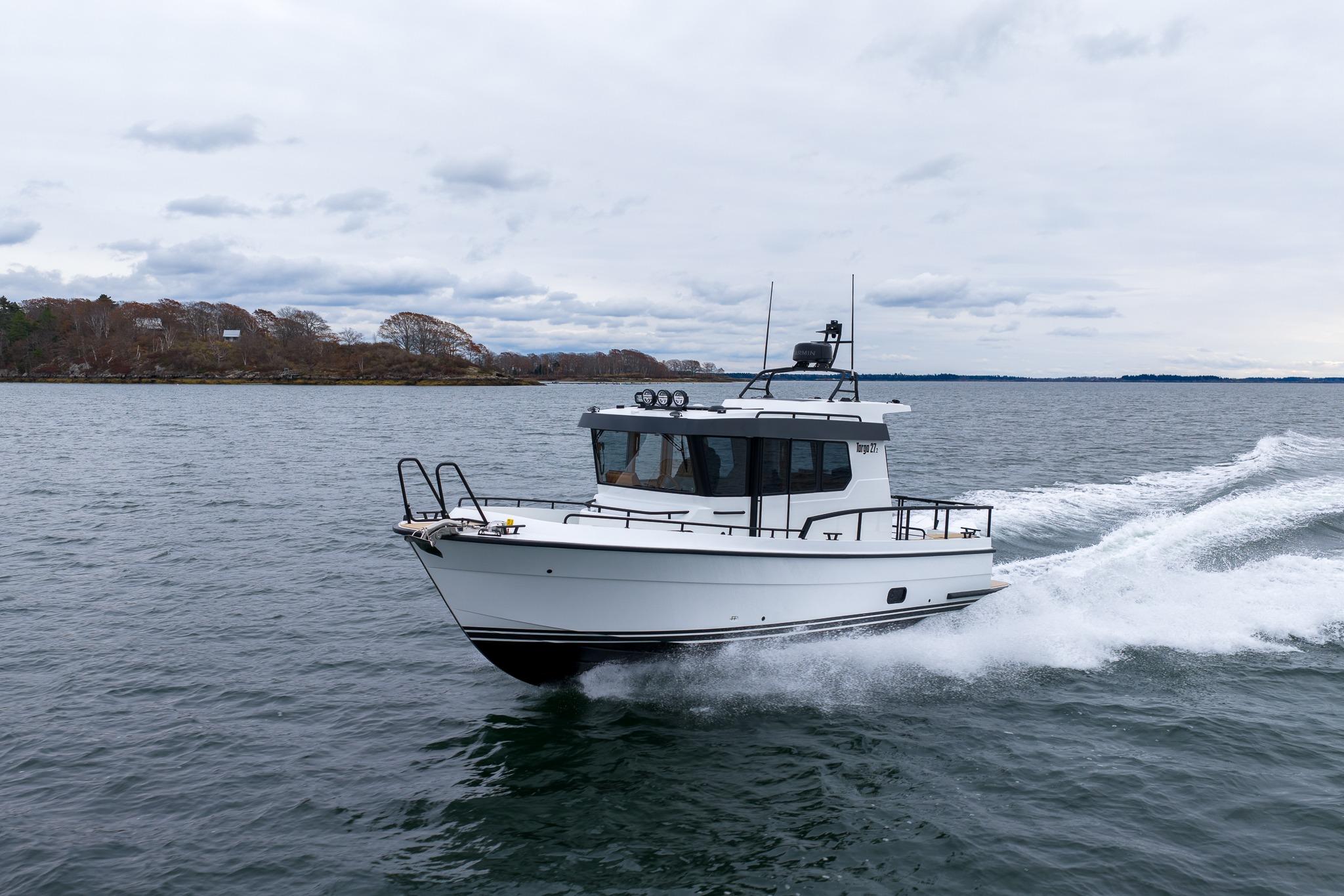 2026 Targa 27.2 boat cruising on open water under cloudy skies.