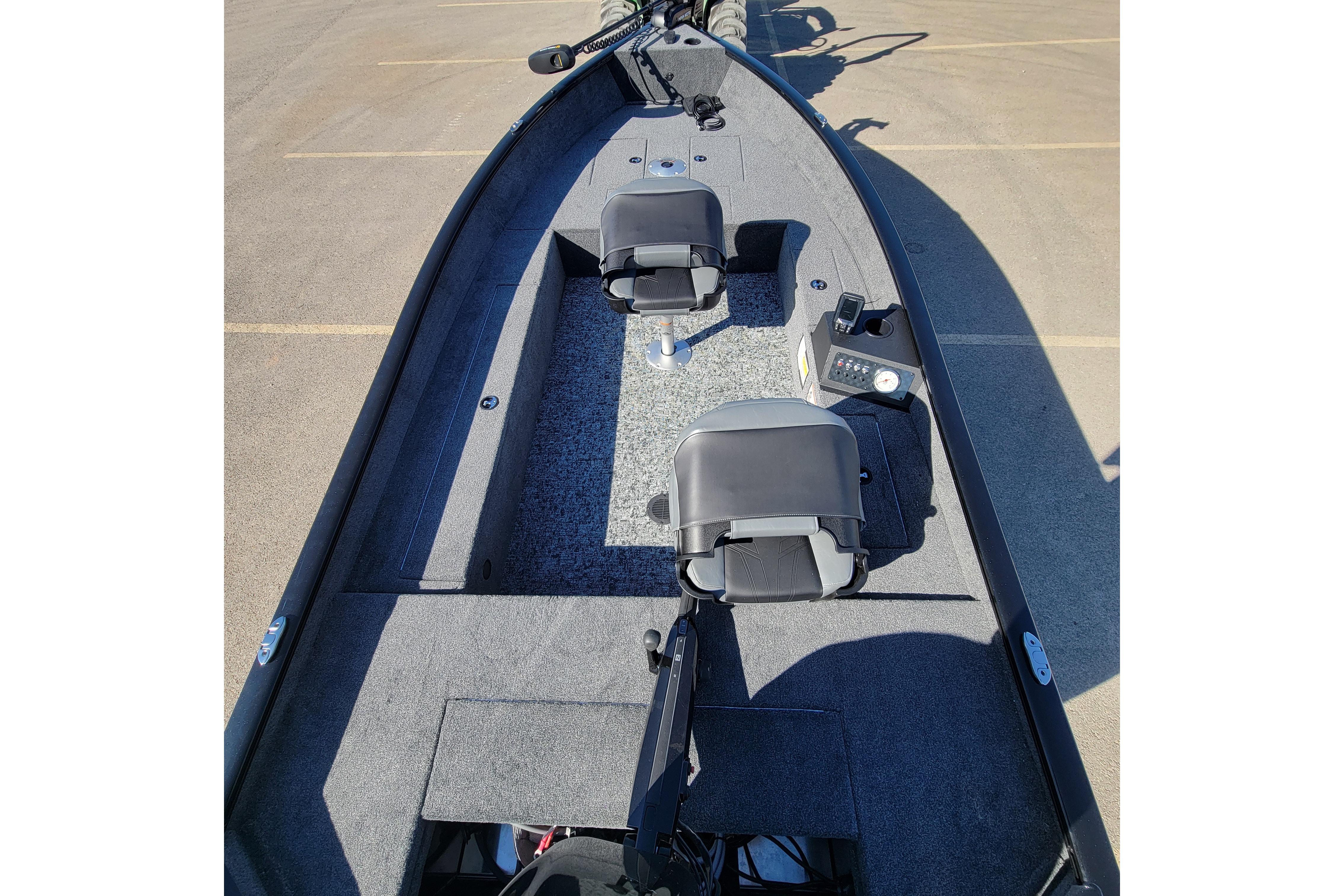 2026 Tracker Super Guide V-16 T boat interior with two seats and control panel.