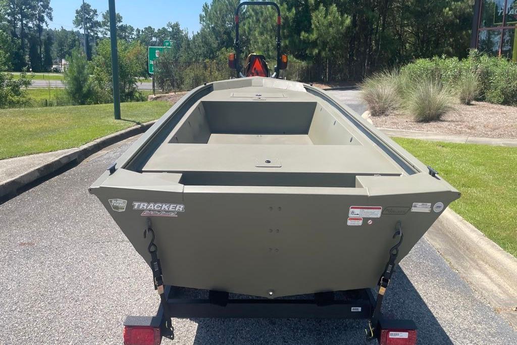 2026 Tracker Grizzly 1648 Utility boat on trailer, parked outdoors.