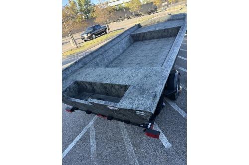 2026 Tracker Grizzly 2072 Utility boat on trailer in parking lot.