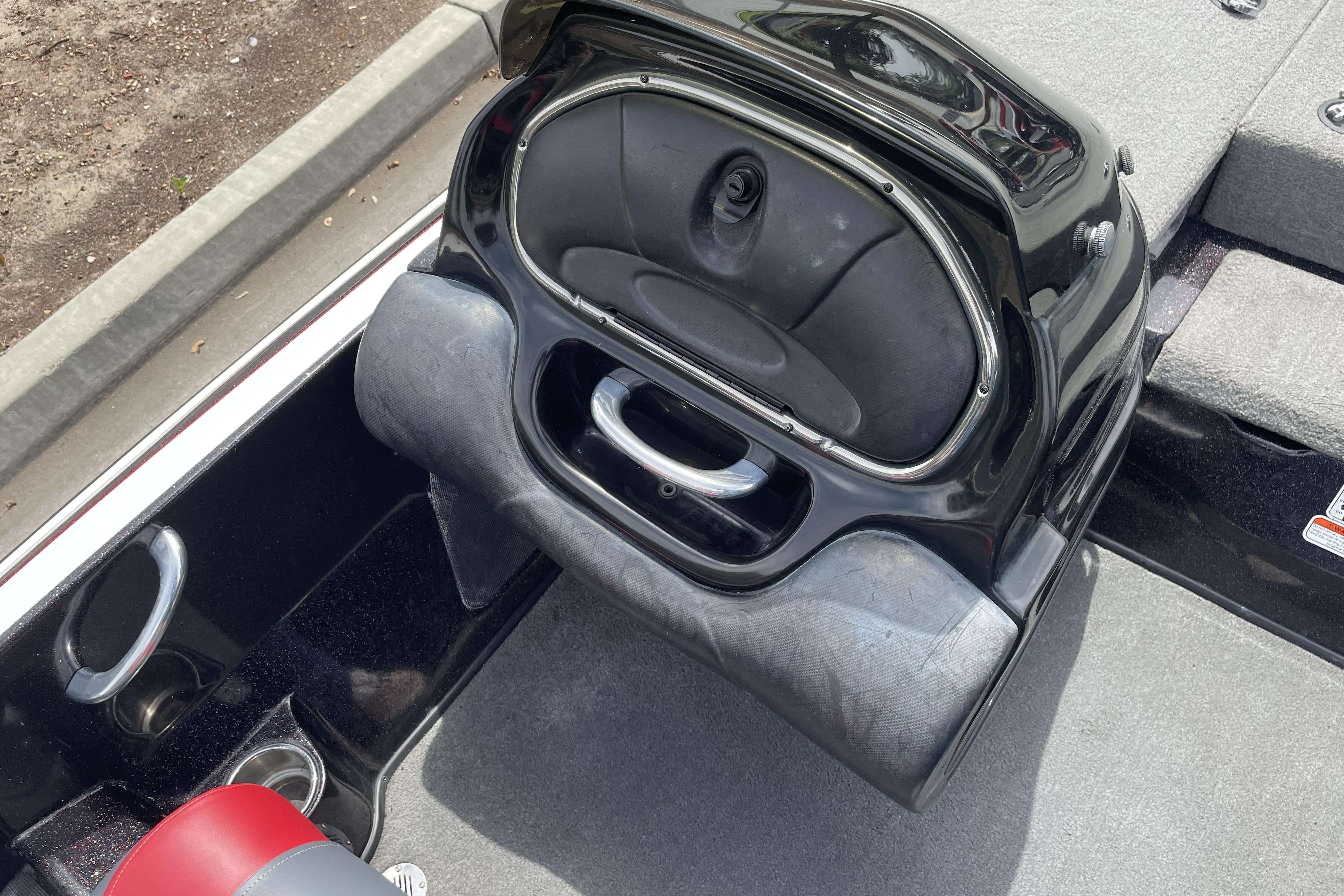 2013 Nitro Z-8 boat interior with open storage compartment and cup holders.