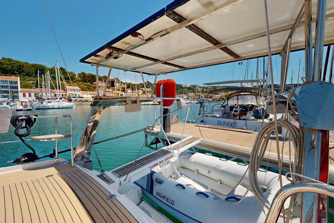 Amel 54 yacht docked in a marina, showcasing deck and nearby boats, 2007 model.