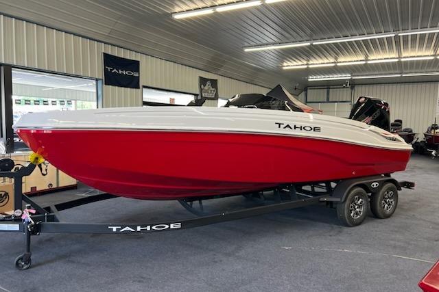 2025 Tahoe T21 boat in showroom, red and white design, on trailer.