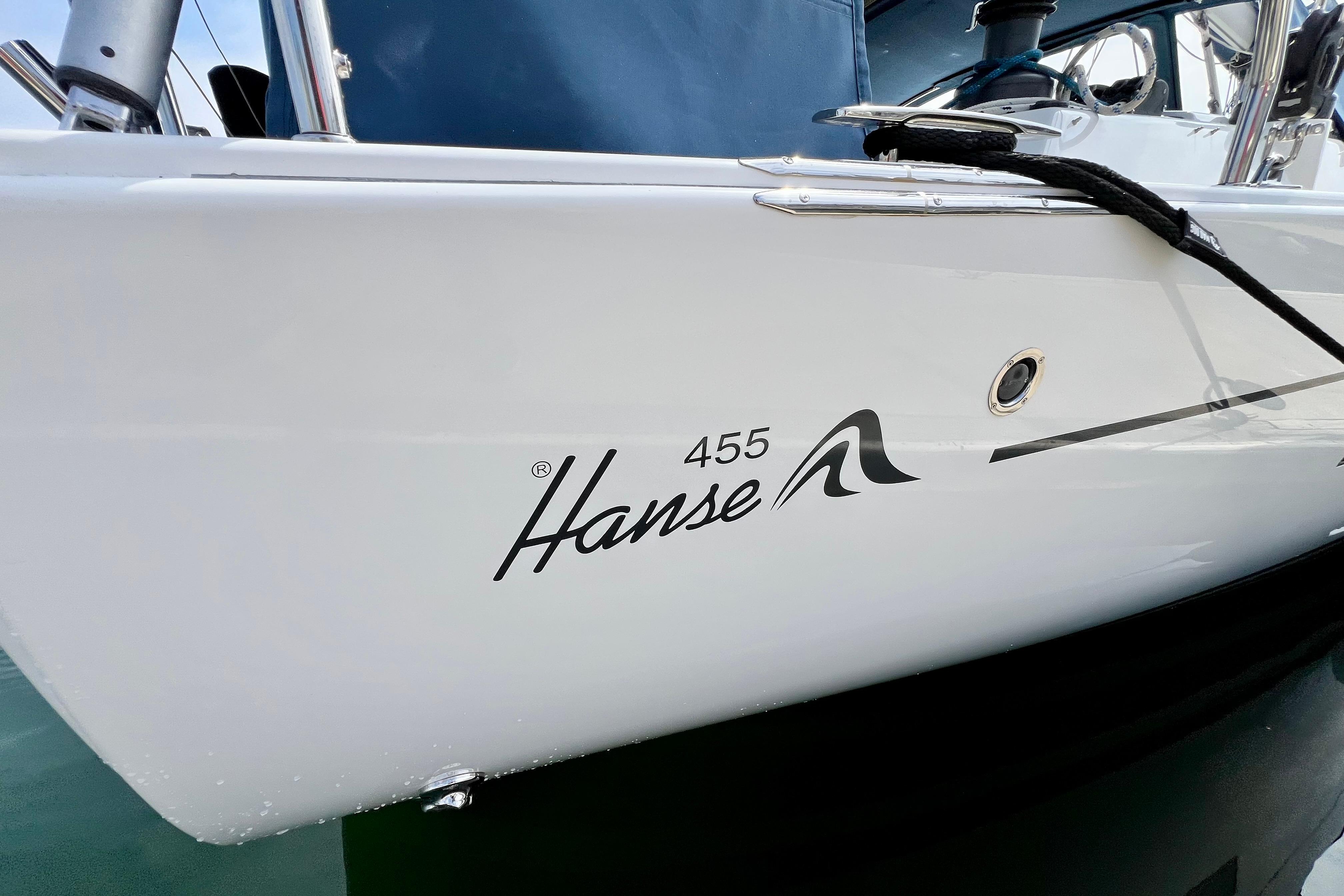 2016 Hanse 455 sailboat side view with logo and mooring line.
