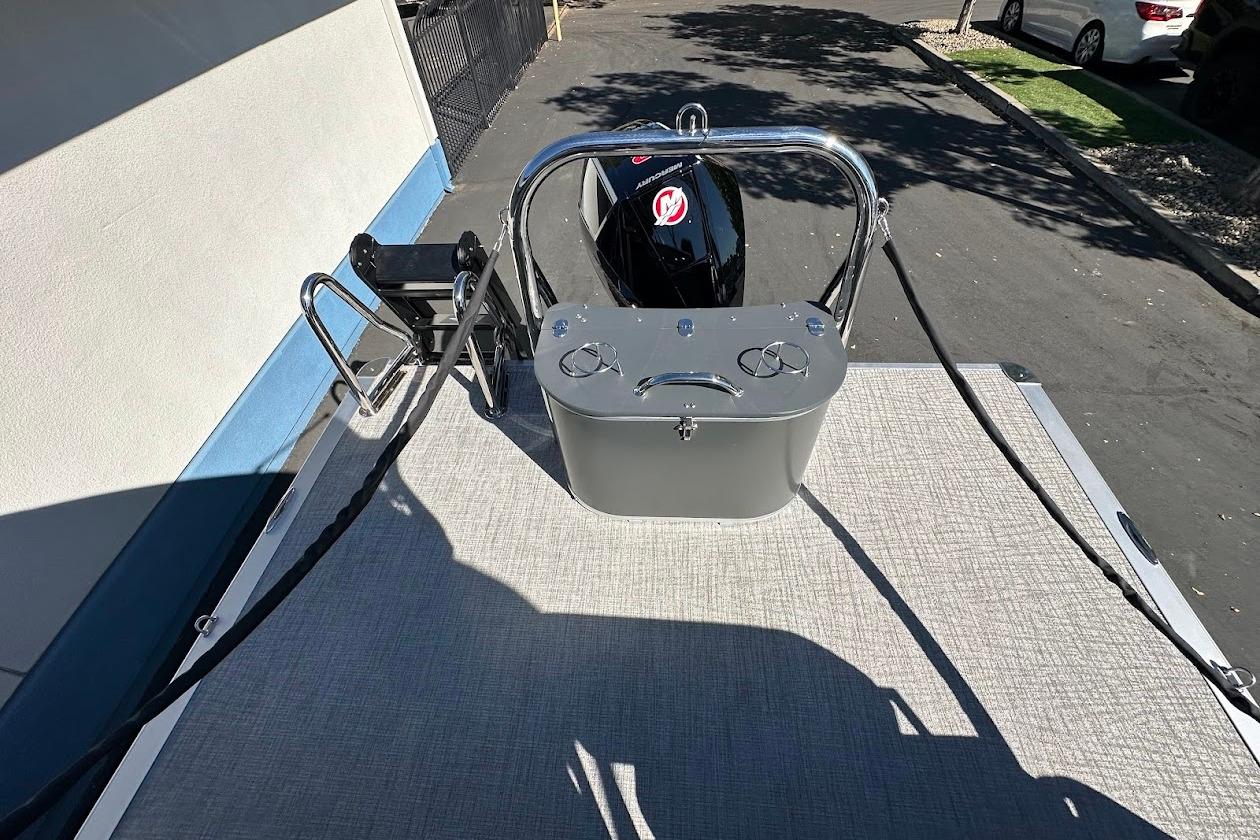 2026 Tahoe Pontoon LTZ Quad Lounger Shift 23 rear view with motor and ladder.